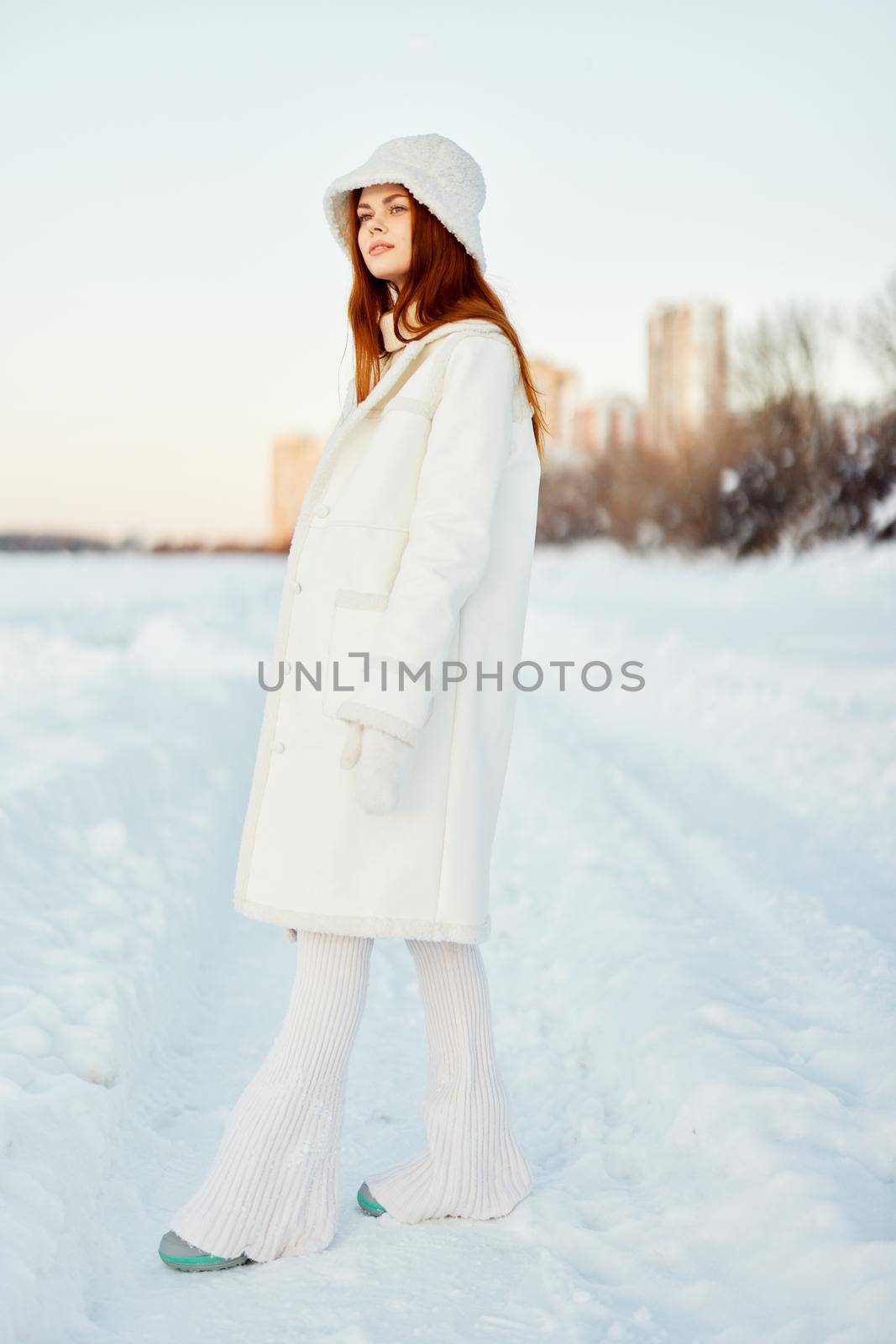 beautiful woman winter clothes walk snow cold vacation nature. High quality photo