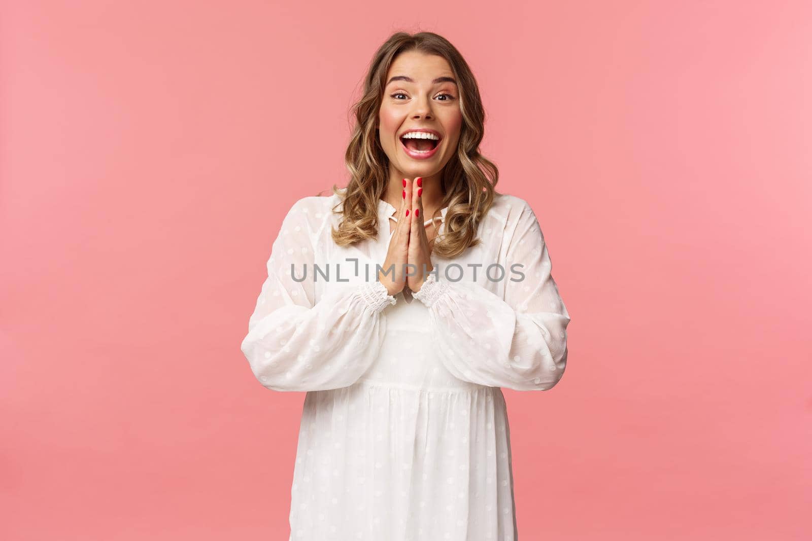 Enthusiastic and excited, happy emotive blond girl applause, clasping hands in thrill and amazement as seeing something really wonderful and cool, smiling as dream came true, pink background by Benzoix