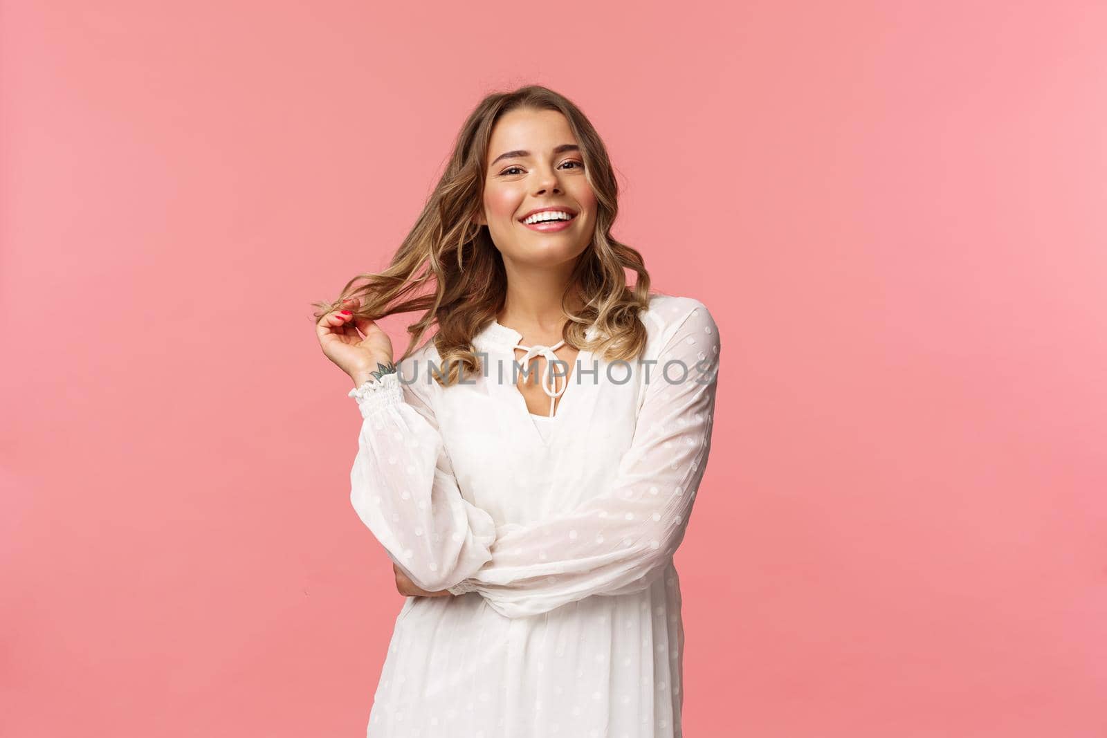 Beautiful and confident blond young 20s woman in stylish white cute dress, touching hair and smiling satisfied, getting dressed for romantic date, concept of women and beauty, pink background by Benzoix