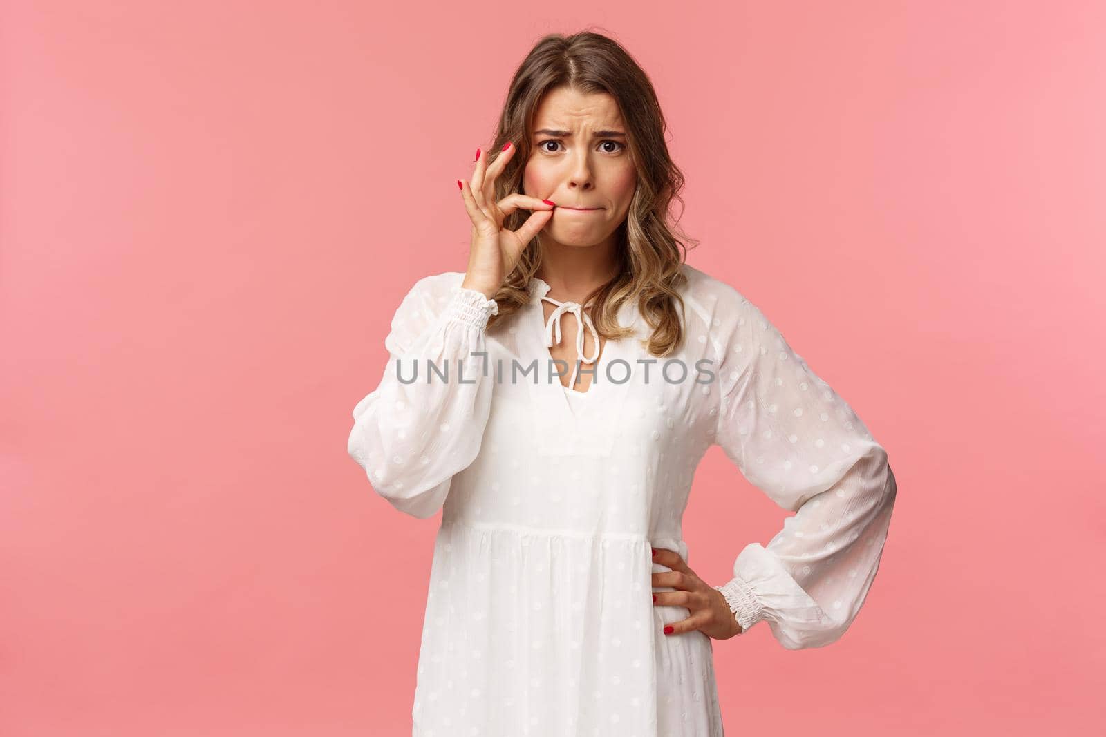 Worried cute blond girl give promise not tell anyone, make zip lips gesture and frowning concerned, heard someone secret, keep silent about situation, standing embarrassed pink background by Benzoix