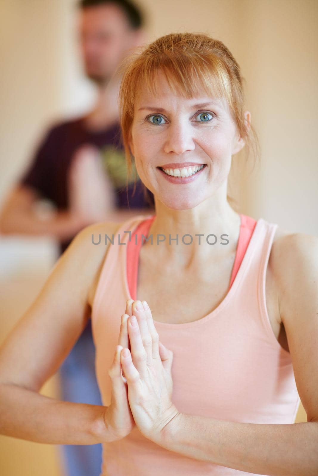 Shot of a woman doing a yoga class.