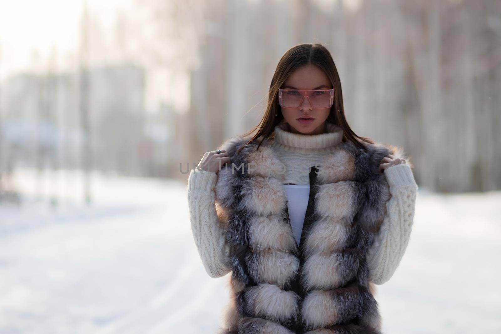 Elegant female in winter clothes in woods by 3KStudio