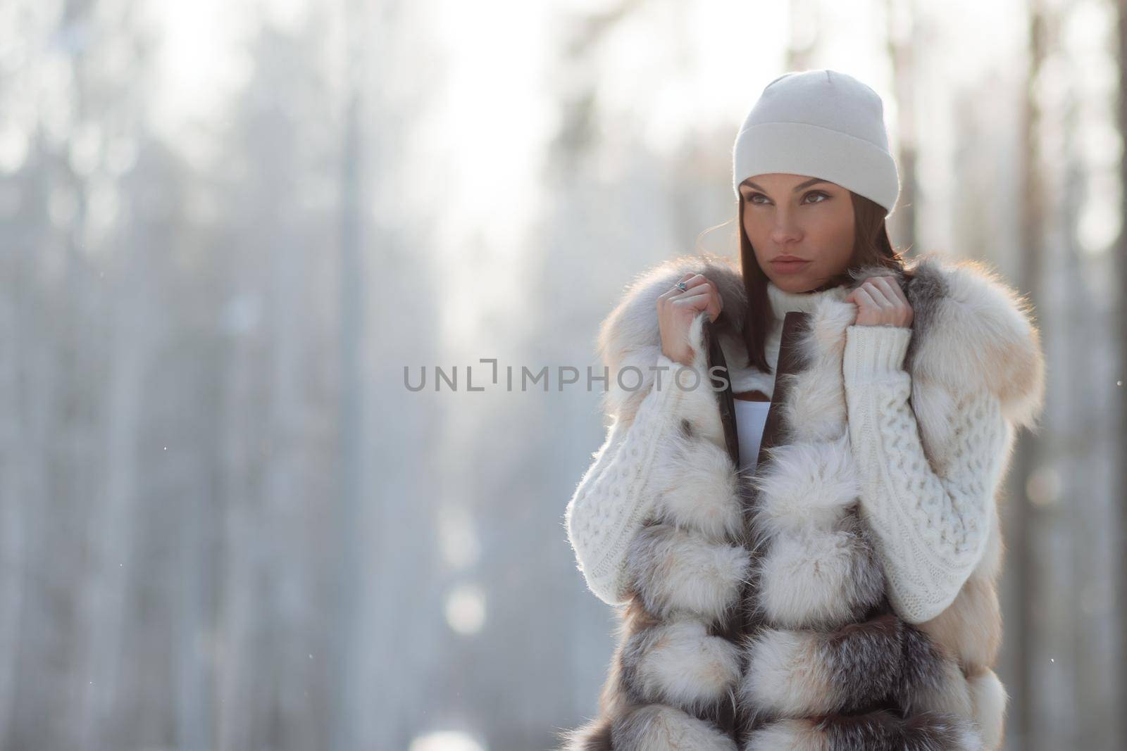 Elegant female in winter clothes in woods by 3KStudio
