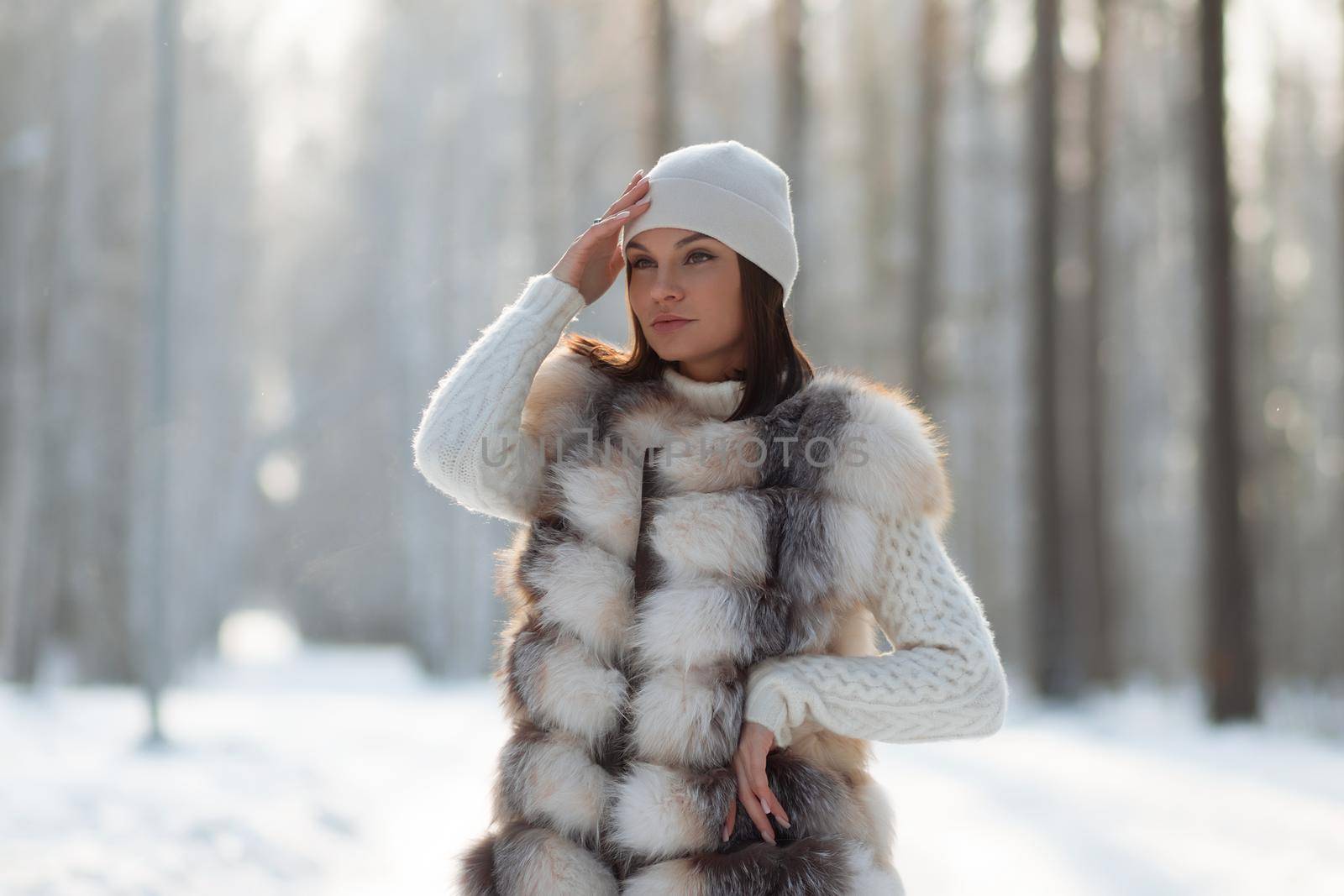 Elegant female in winter clothes in woods by 3KStudio