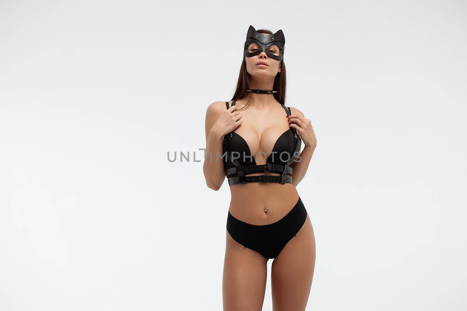 Sexy woman in black mask and lingerie in studio by 3KStudio