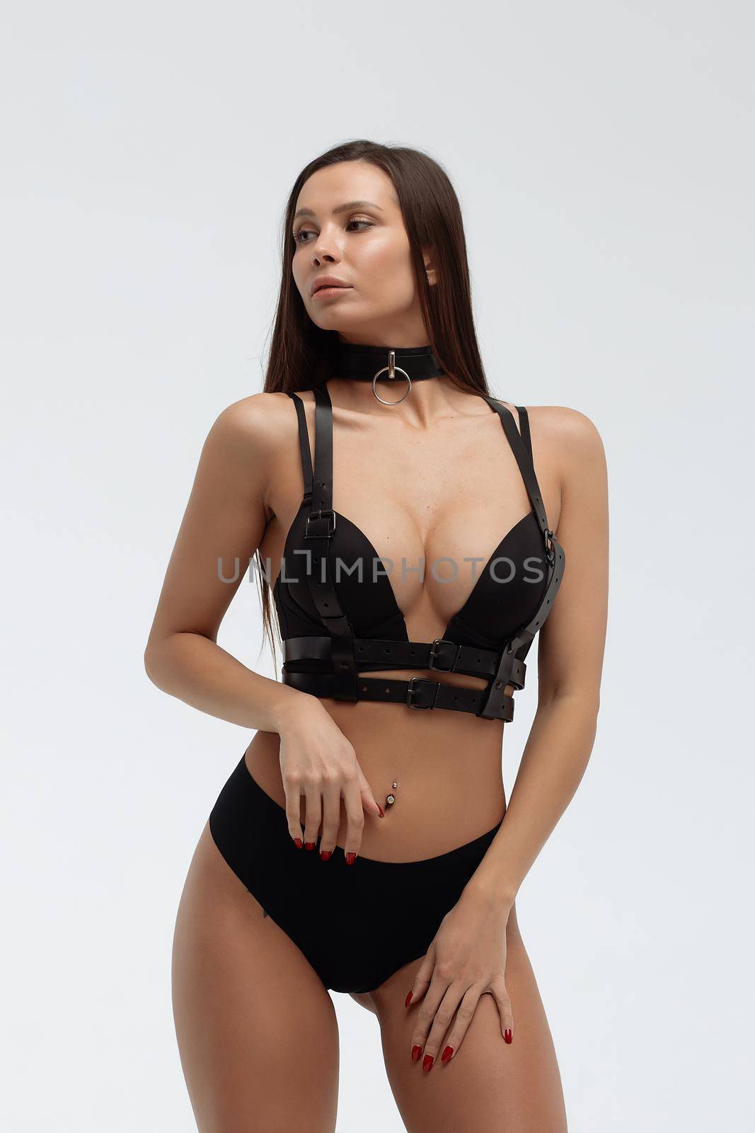 Crop view of attractive erotic young woman in lingerie crossing hands