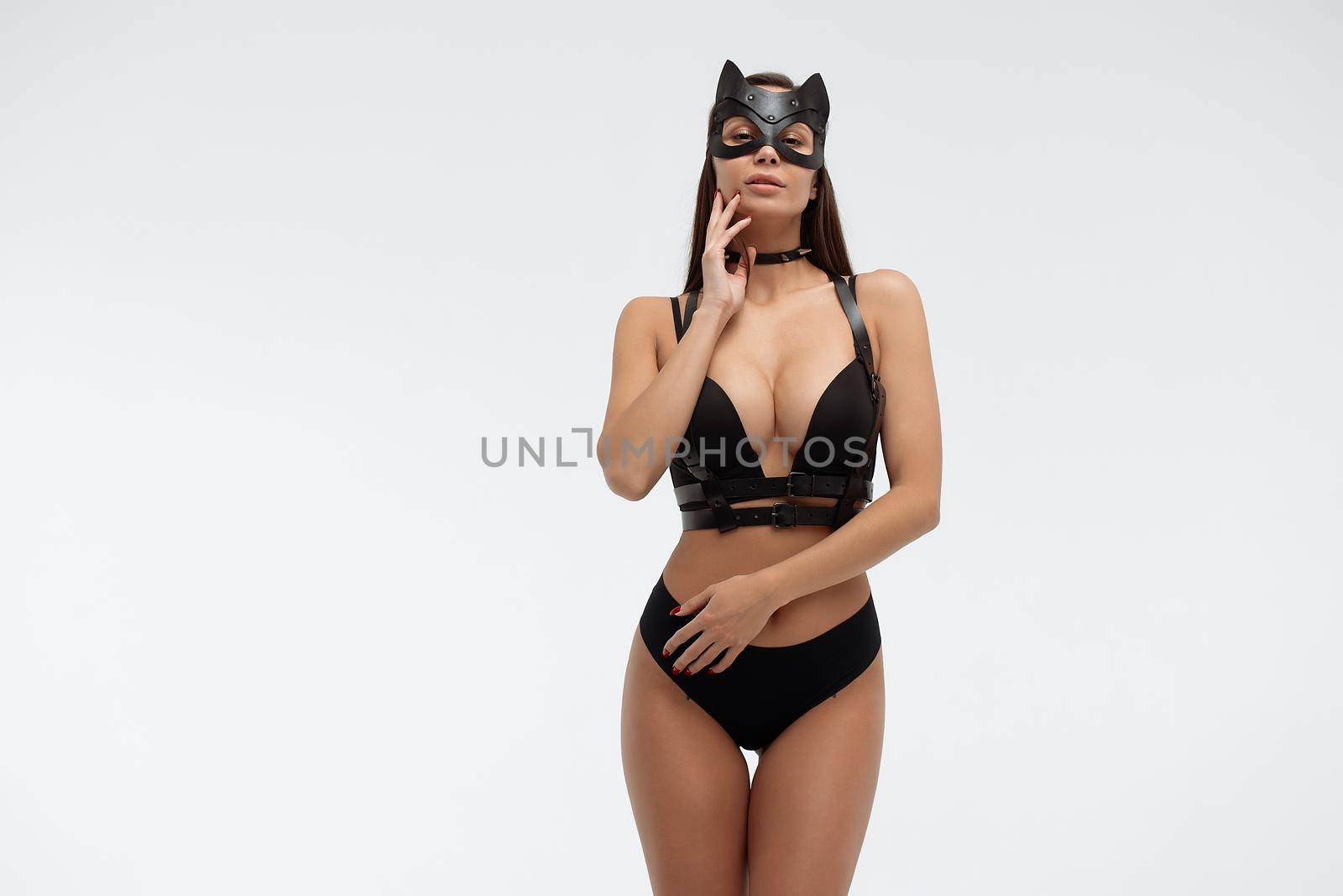 Sexy woman in black mask and lingerie in studio by 3KStudio