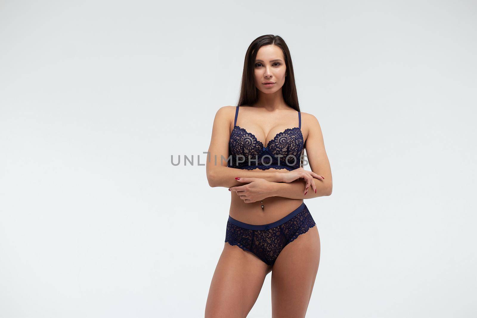 Calm woman in lace lingerie in studio by 3KStudio