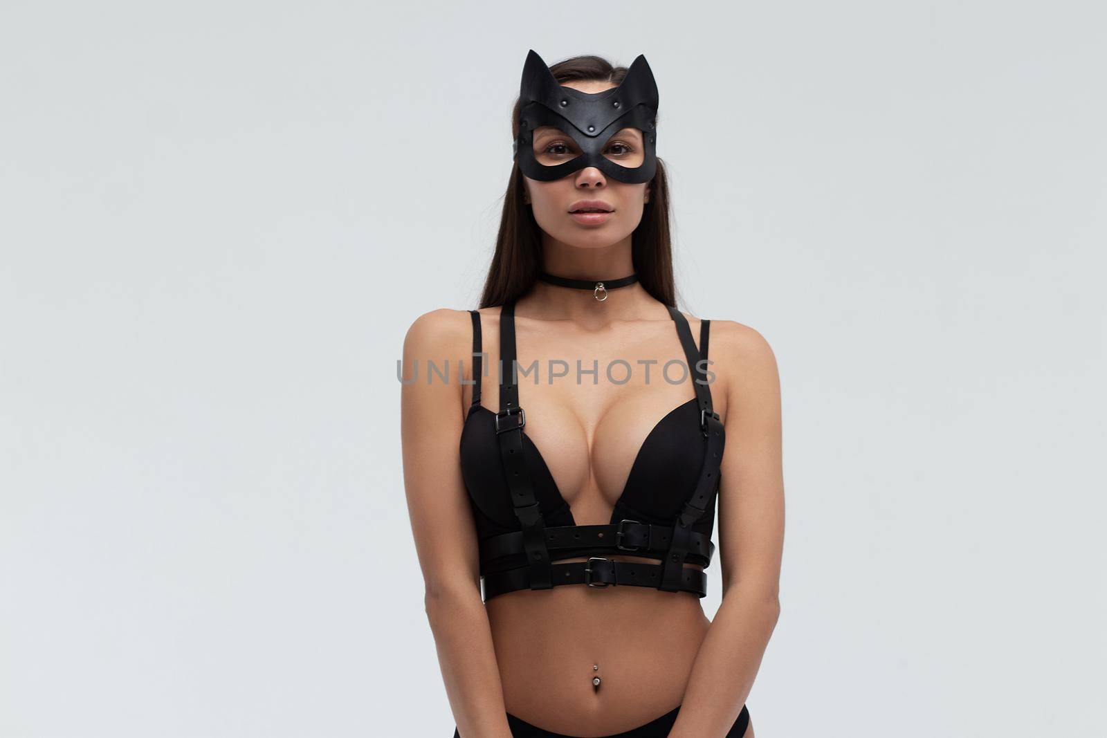 Sexy woman in black mask and lingerie in studio by 3KStudio