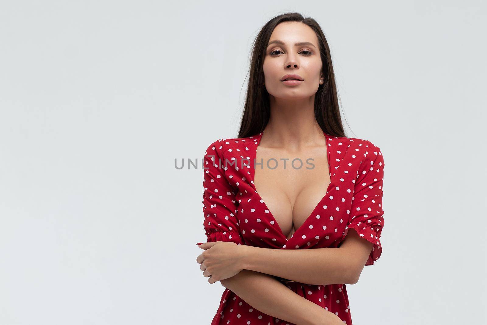 Seductive woman in short dress in studio by 3KStudio