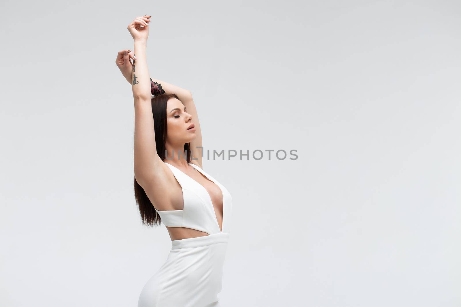 Sensual woman in sexy dress on light background by 3KStudio