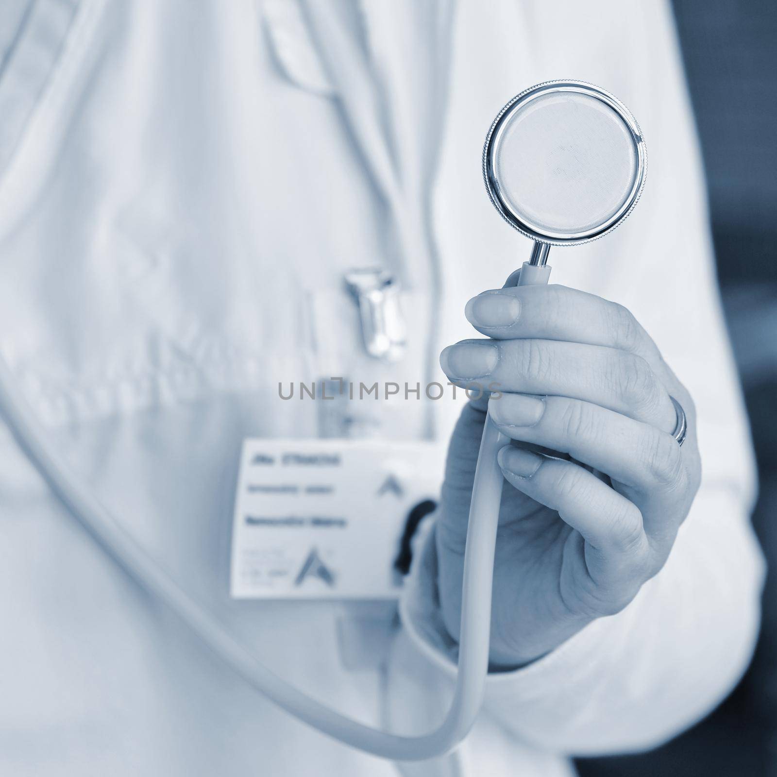 Female doctor holding a stethoscope. Concept for health and medicine. Hospital background.