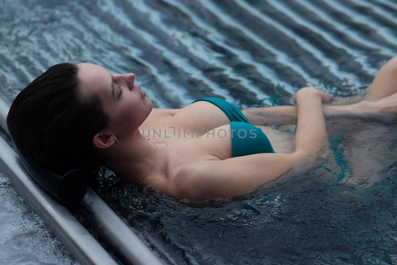 Seductive female resting in pool by 3KStudio