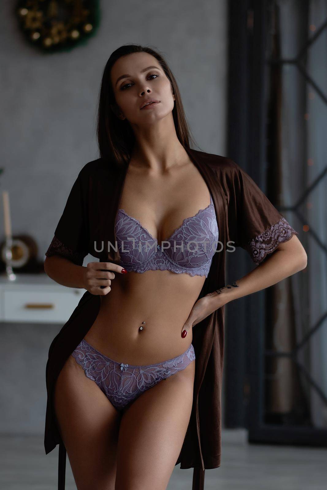 Alluring woman in underwear and silk robe by 3KStudio