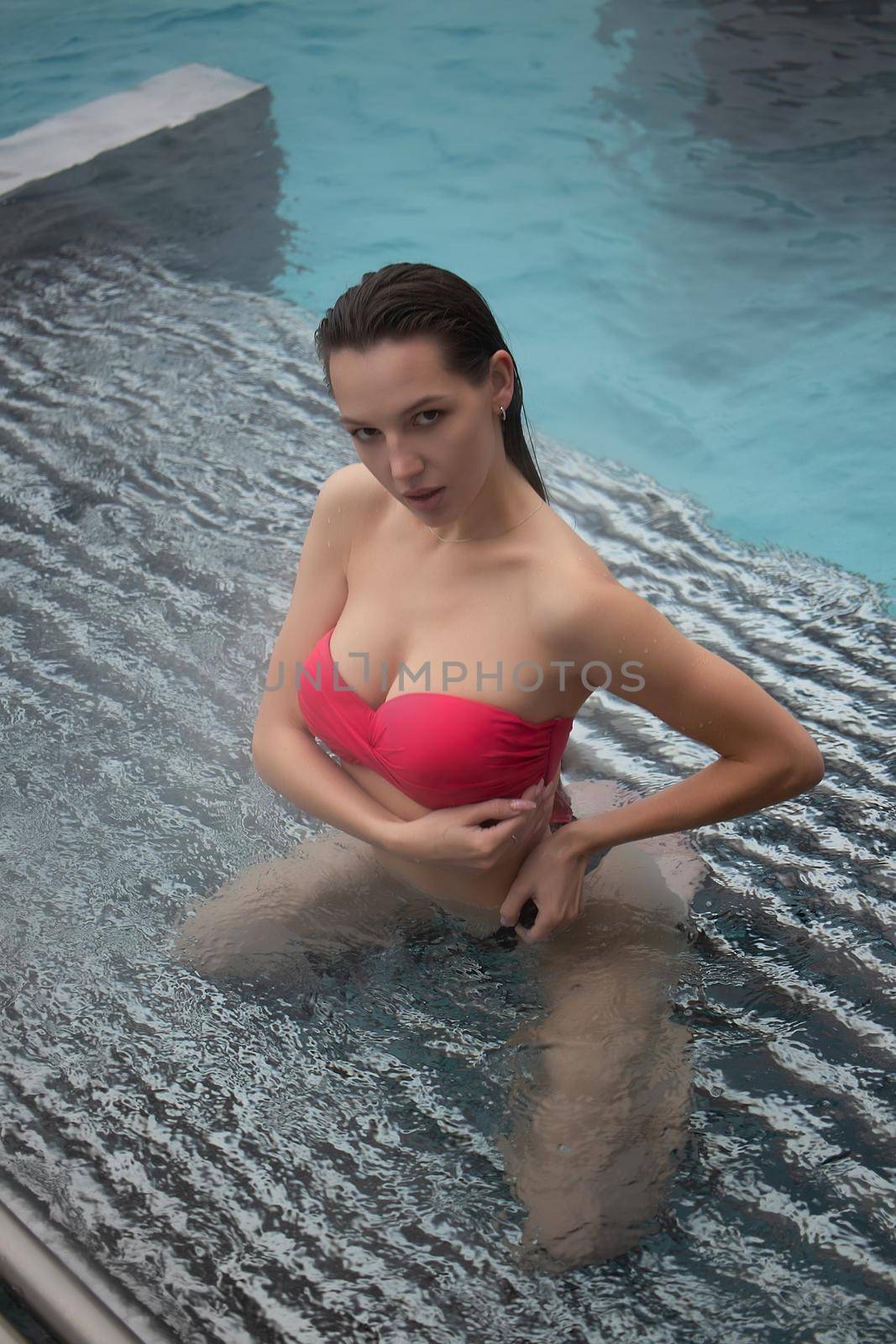 Sensual woman chilling in hot water by 3KStudio