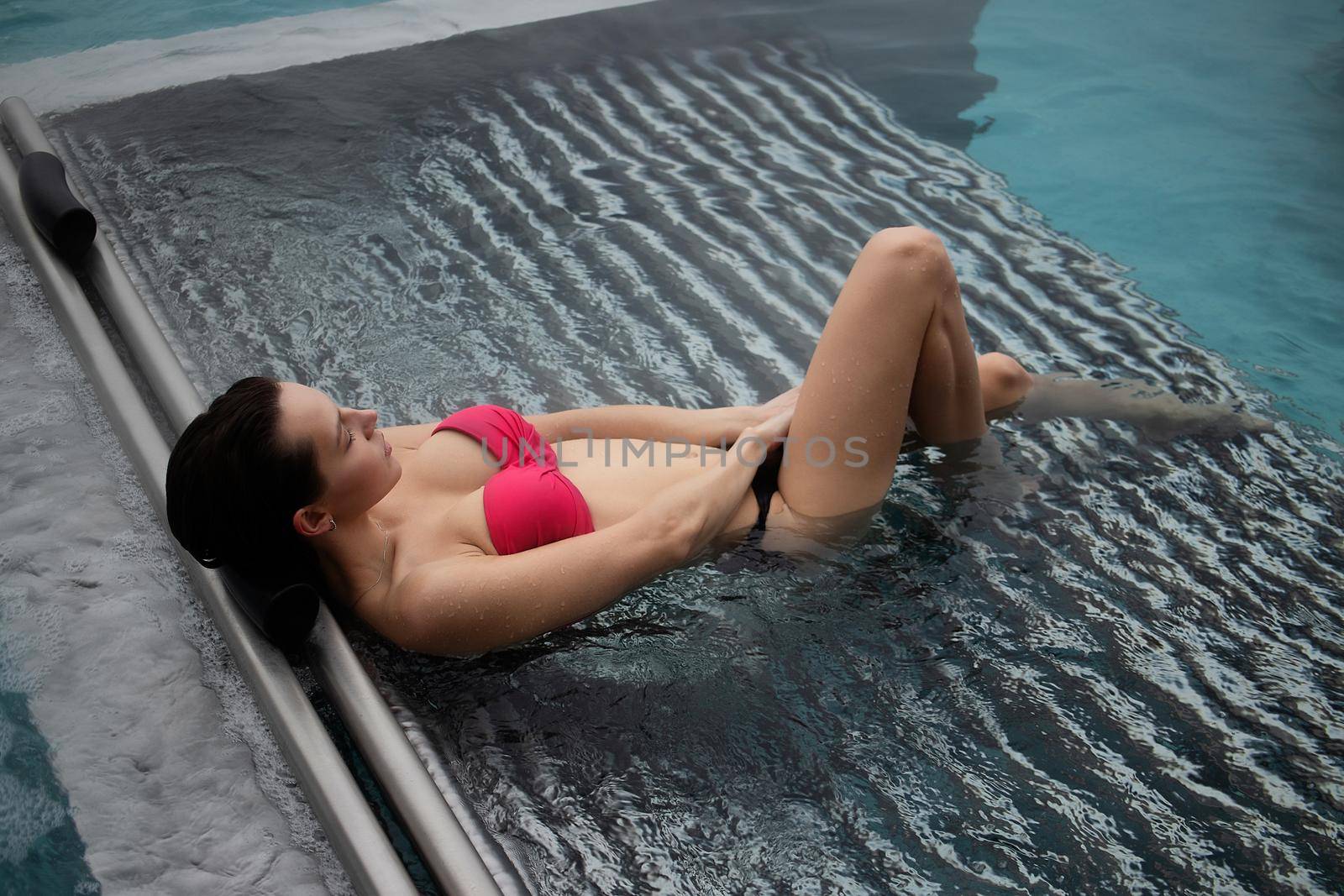 Seductive female resting in pool by 3KStudio