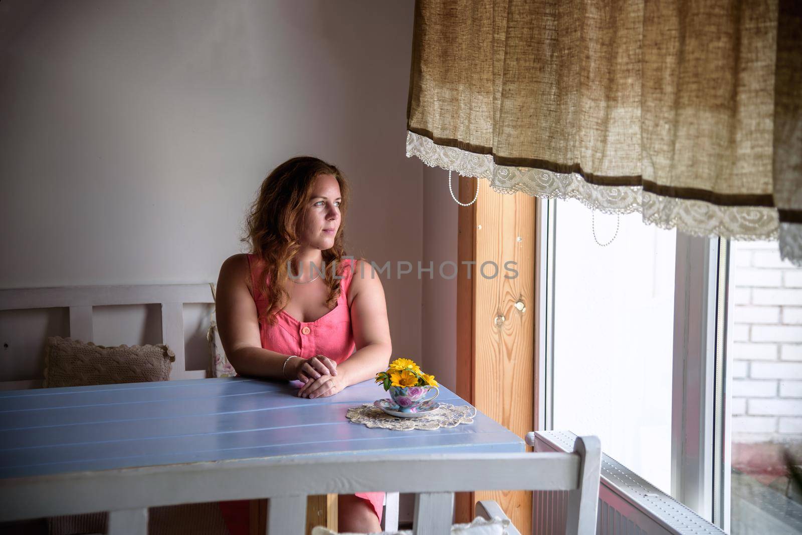 Enthusiastic Woman in trendy summer outfit chilling in cozy cafe, looking around , happy emotions. Traveling woman.
