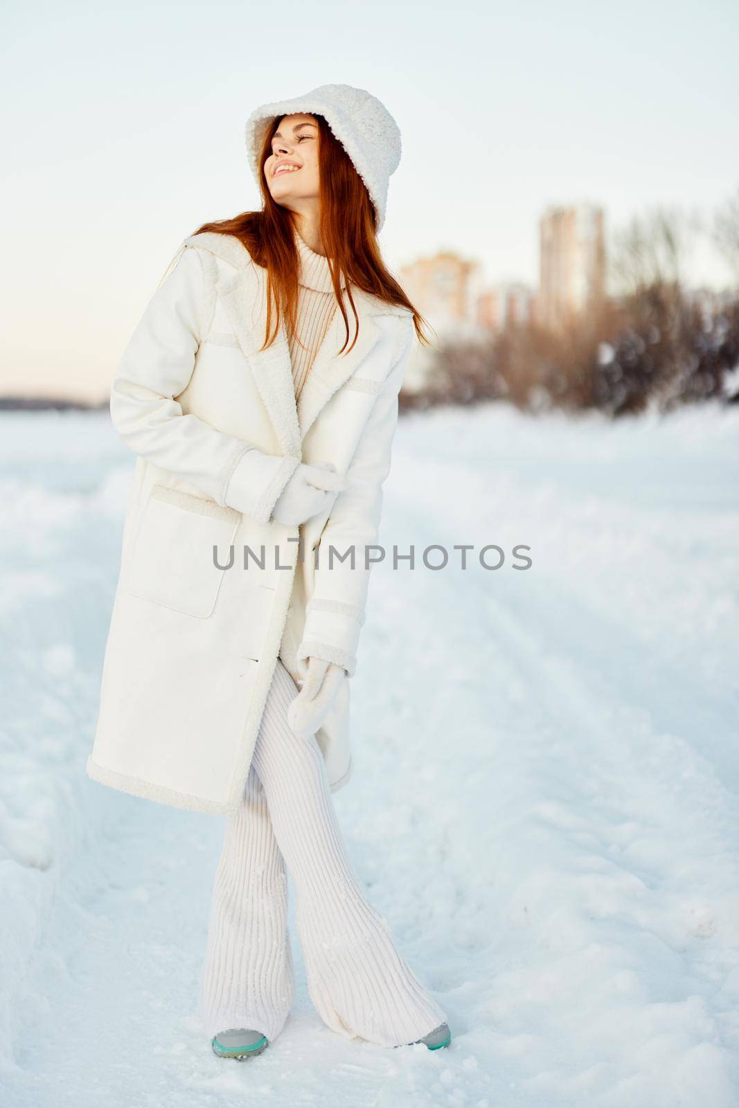 pretty woman in a white coat in a hat winter landscape walk Fresh air by SHOTPRIME