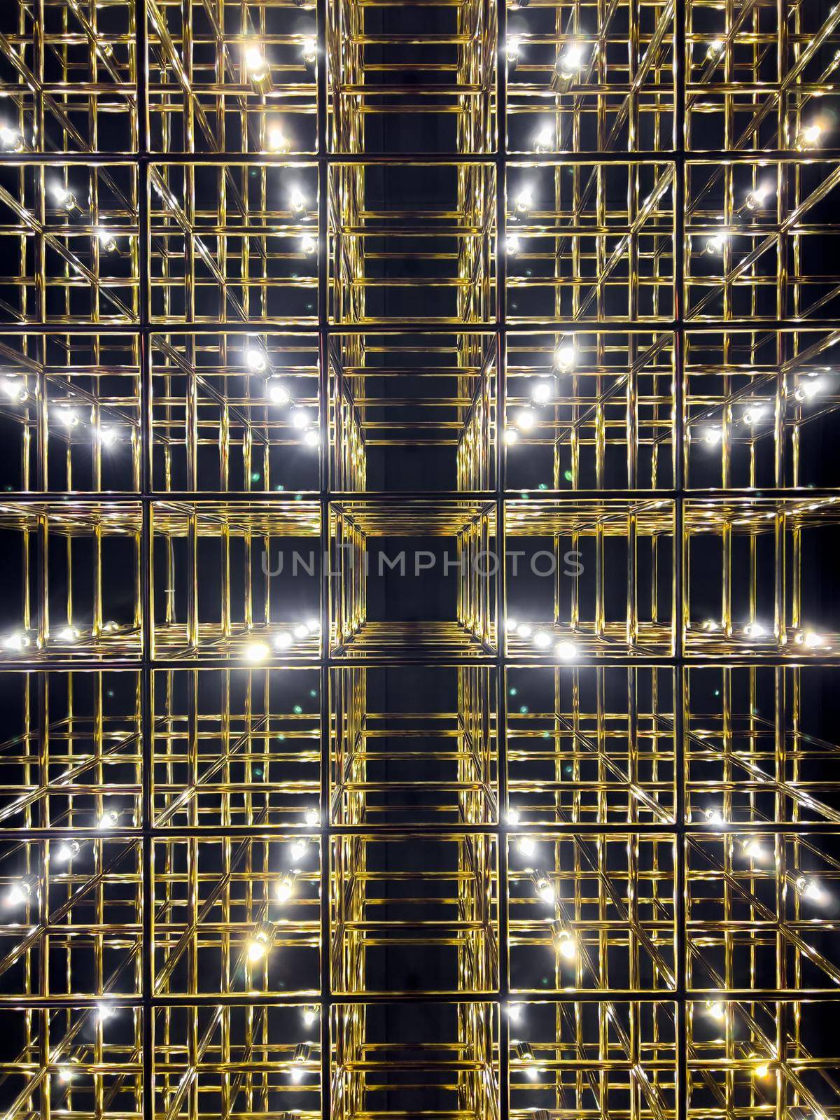 Abstract gold grid with backlight, vivid perspective symmetrical image, art deco pattern. High quality photo