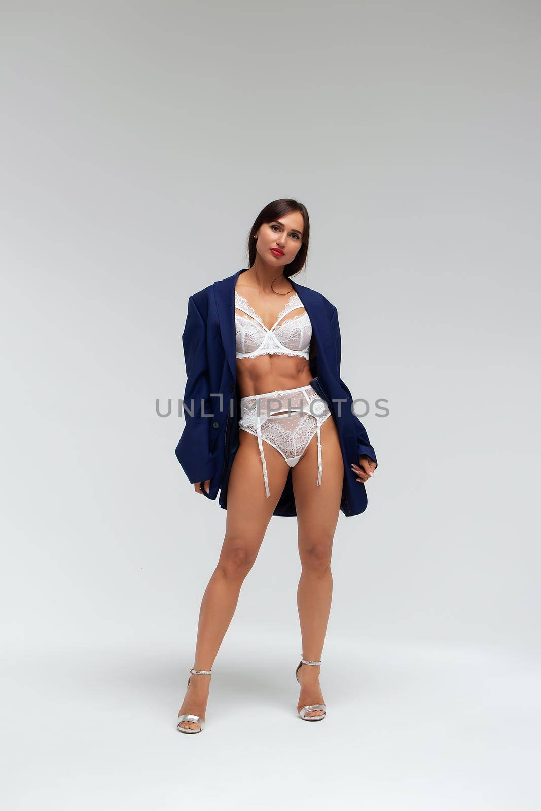 Slim woman in lingerie in studio by 3KStudio