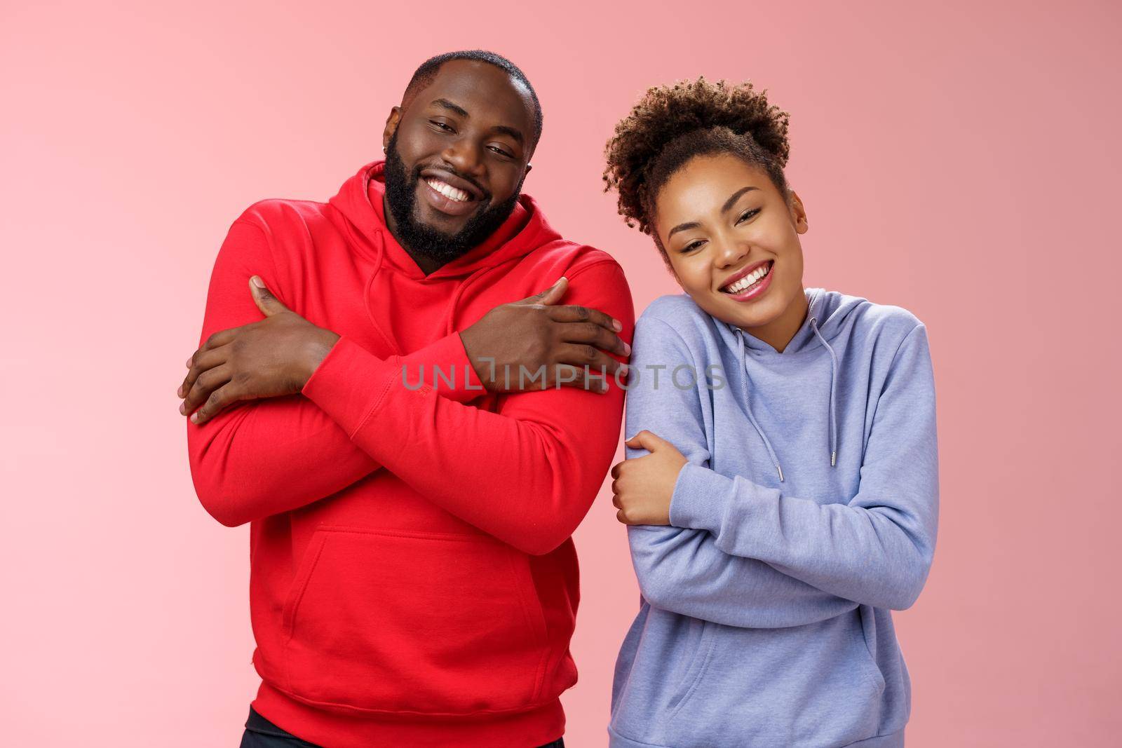 Two african american man woman couple feel comfortable warm together embracing each other cuddling happily tilting head look cute express love strong healthy relationship, smiling delighted by Benzoix