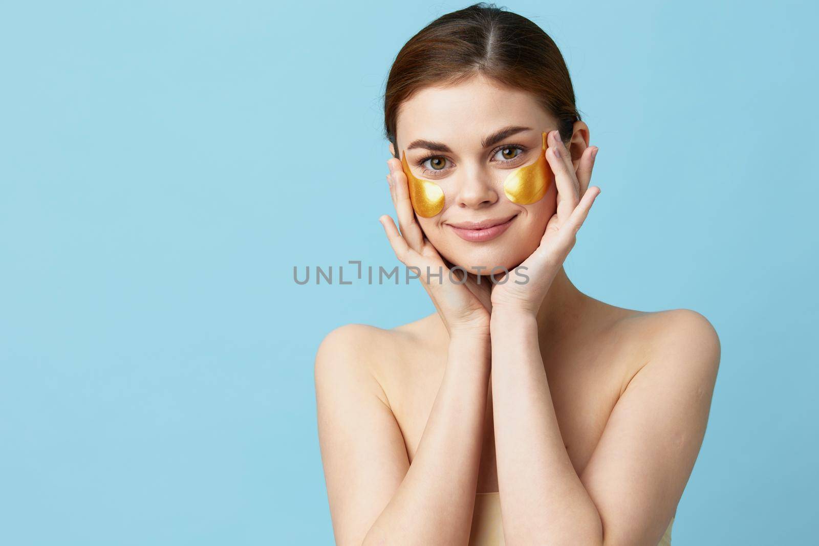 pretty woman golden patches on the face isolated background. High quality photo