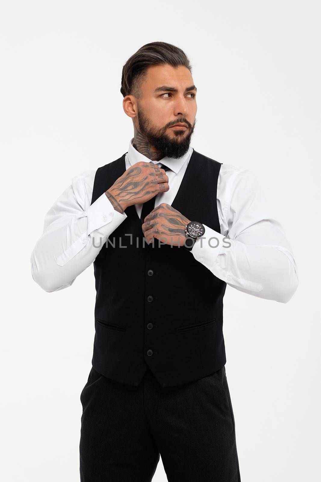 Tattooed male model in formal clothes with tie by 3KStudio