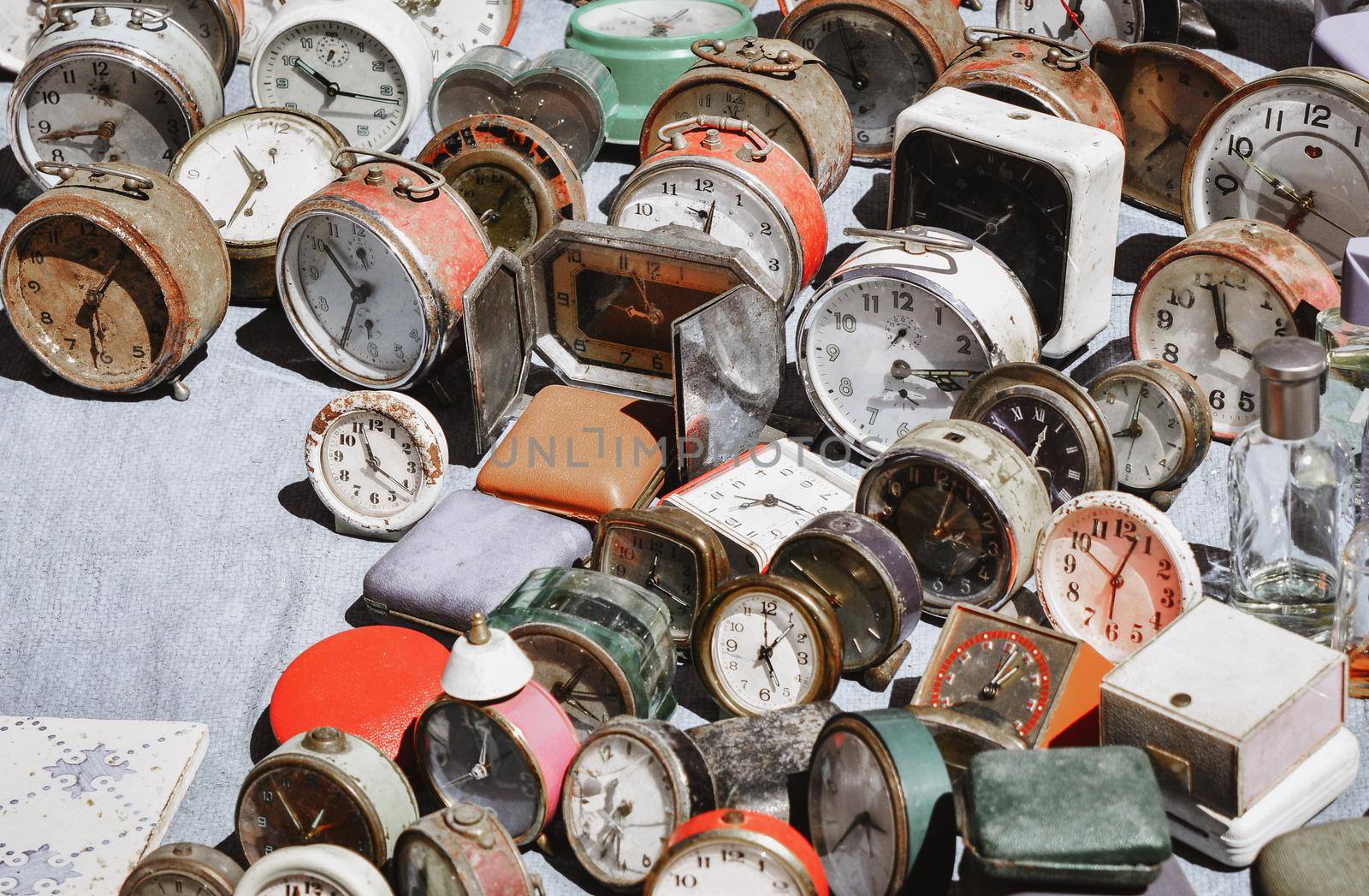 Many vintage clocks at a flea market