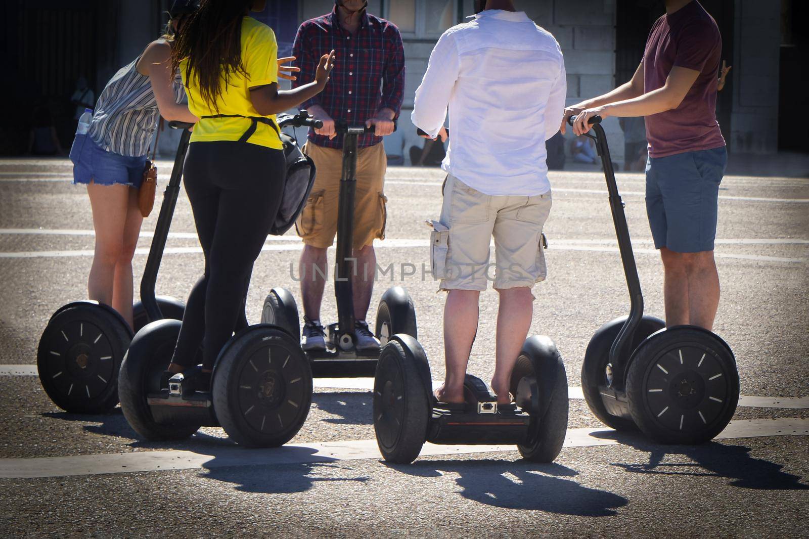 A group of people guided segway tour in a tourist place