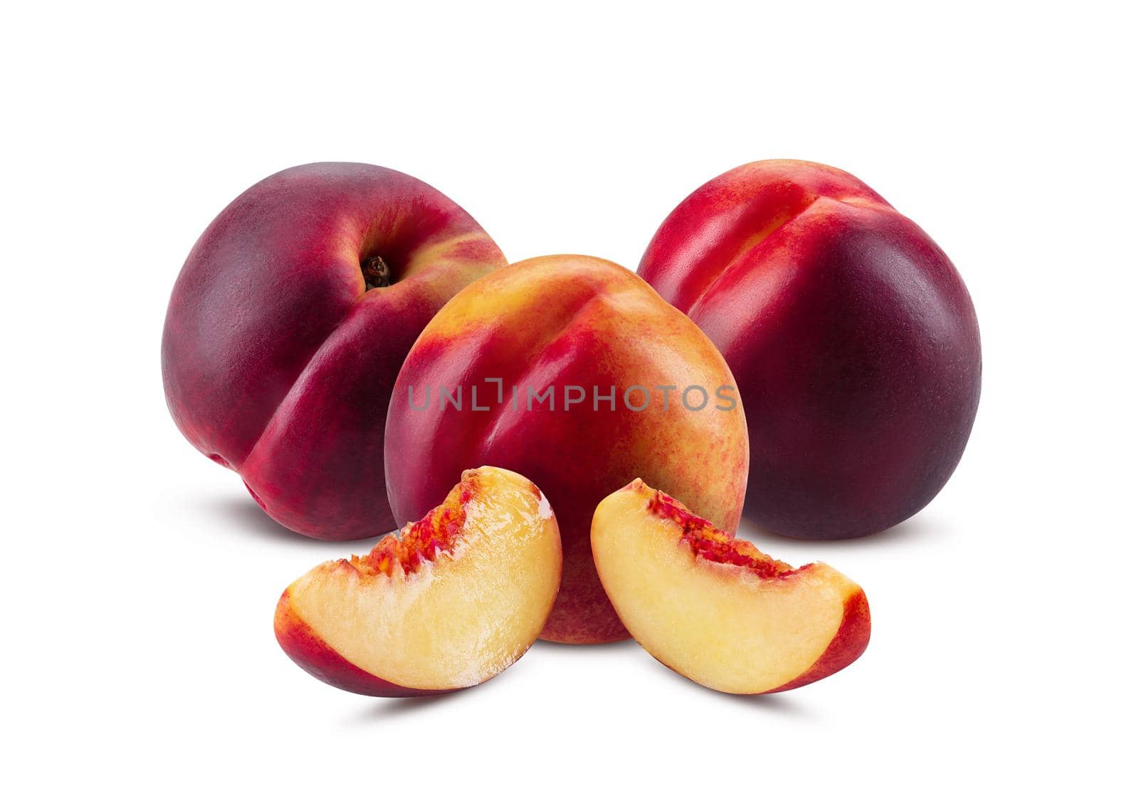 Three smooth-skinned, sappy nectarines and two slices without kernel isolated on white background with copy space for text or images. Variety of peach. Side view. Close-up shot.