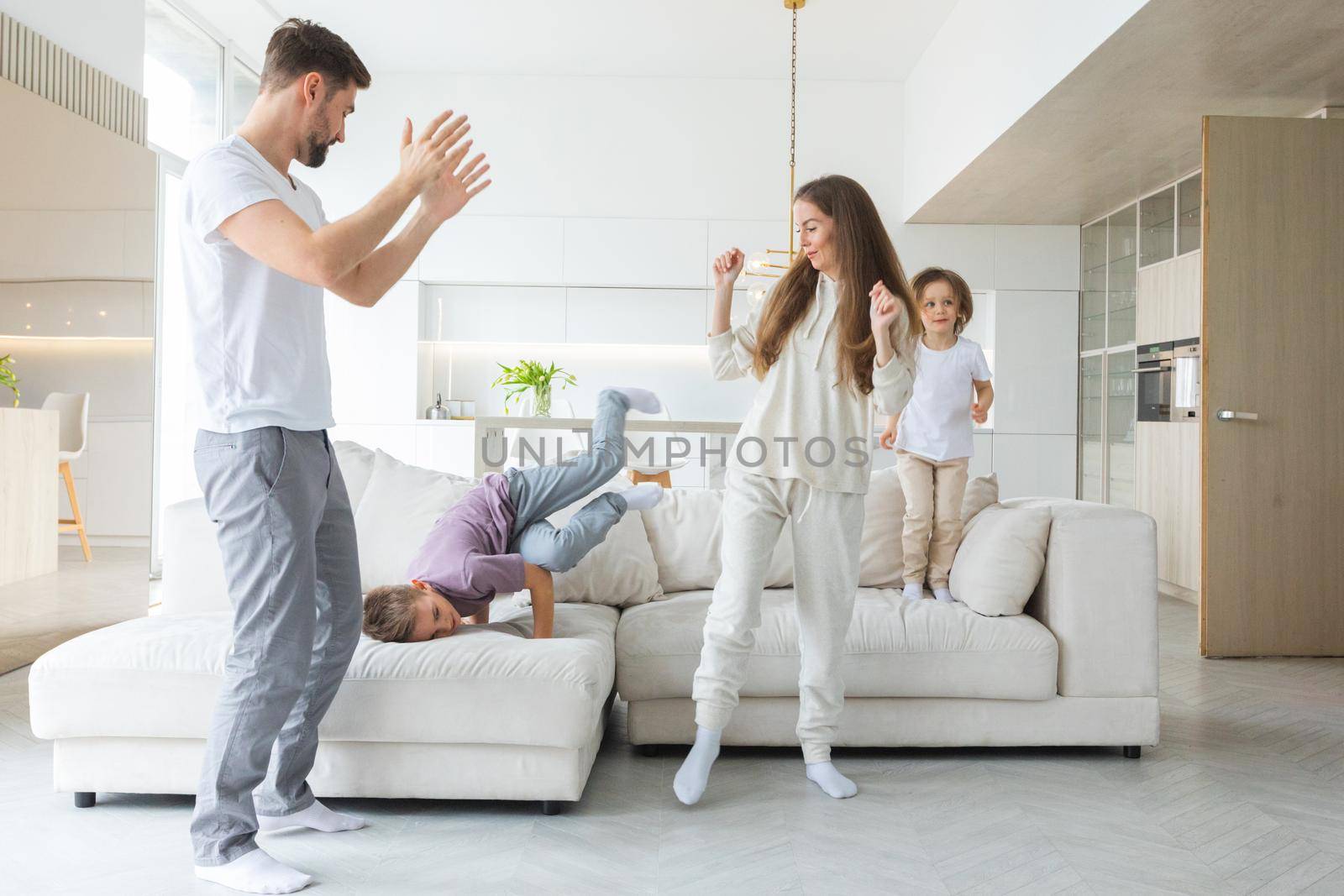 Active family dancing together by ALotOfPeople