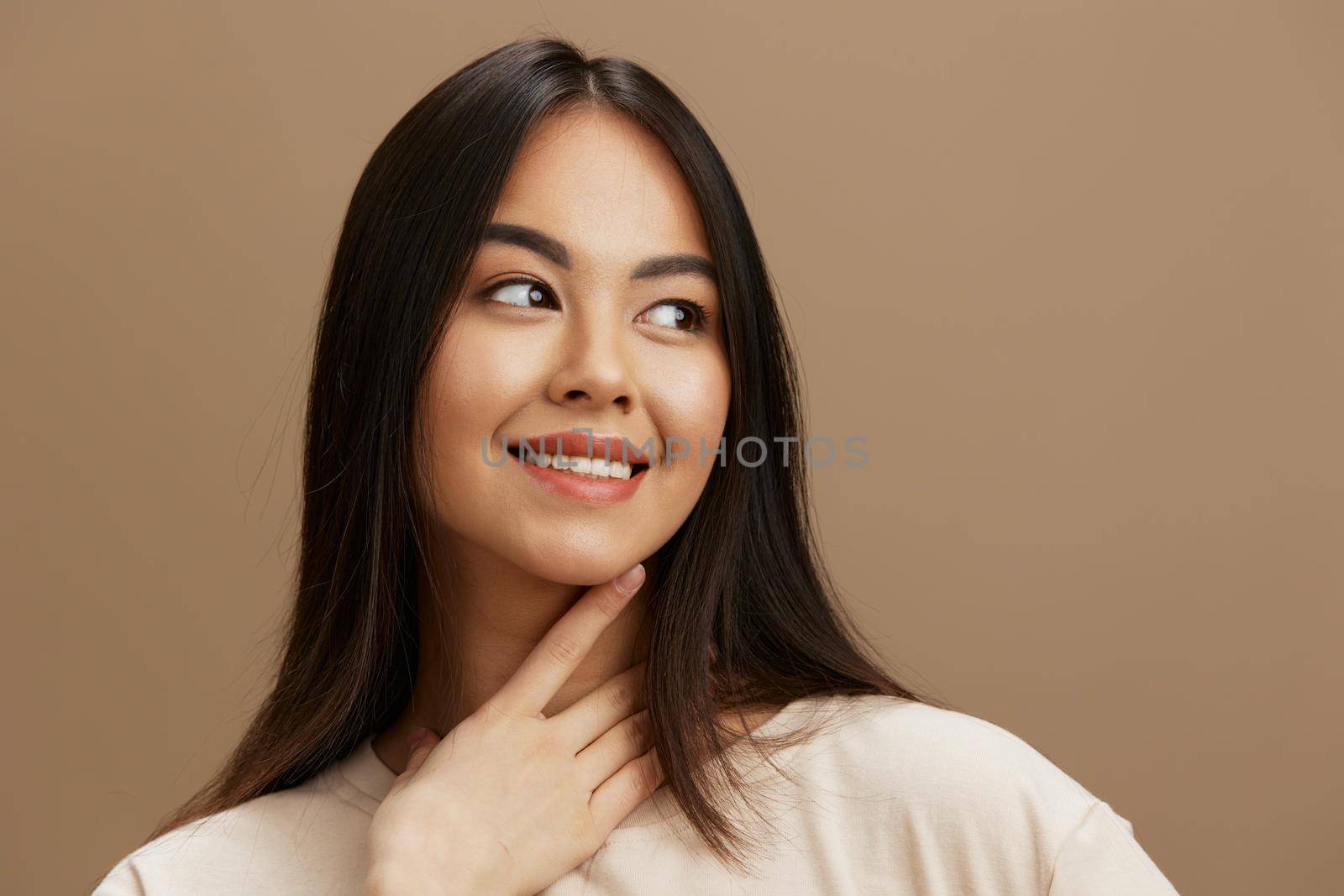 portrait woman attractive look charmin in a t-shirt studio model. High quality photo