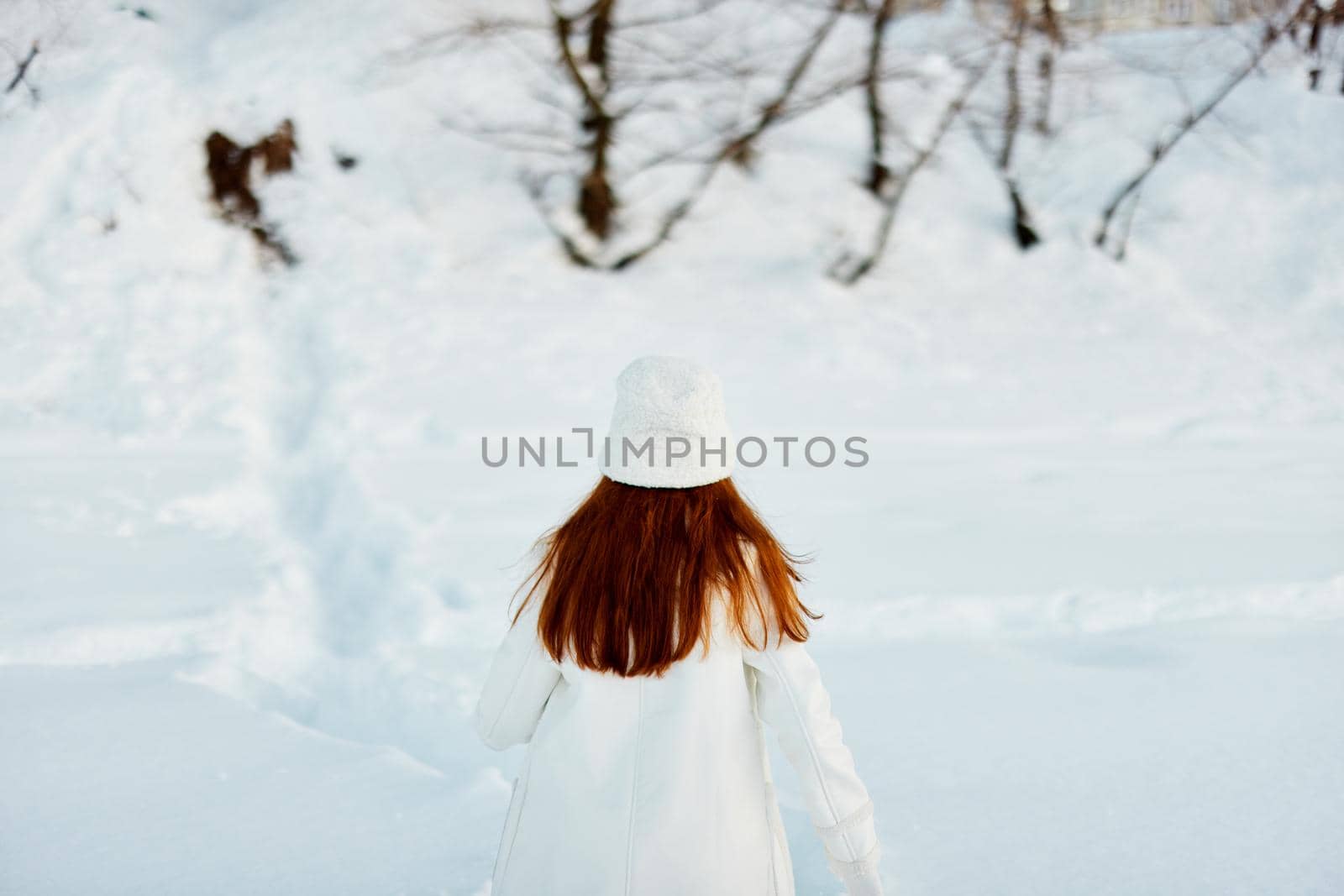 beautiful woman red hair snow field winter clothes Lifestyle by SHOTPRIME