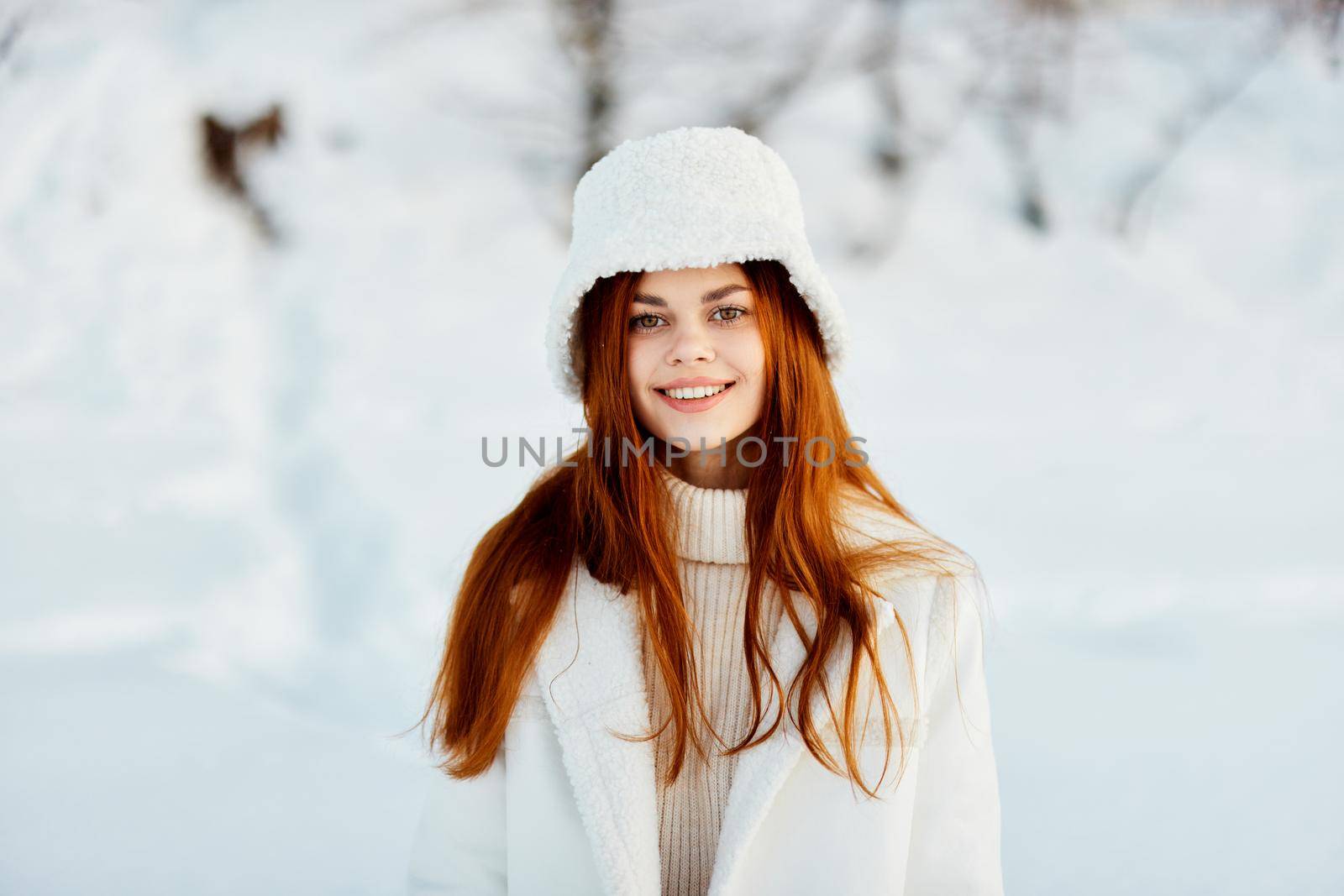 woman in a white coat in a hat winter landscape walk Lifestyle by SHOTPRIME