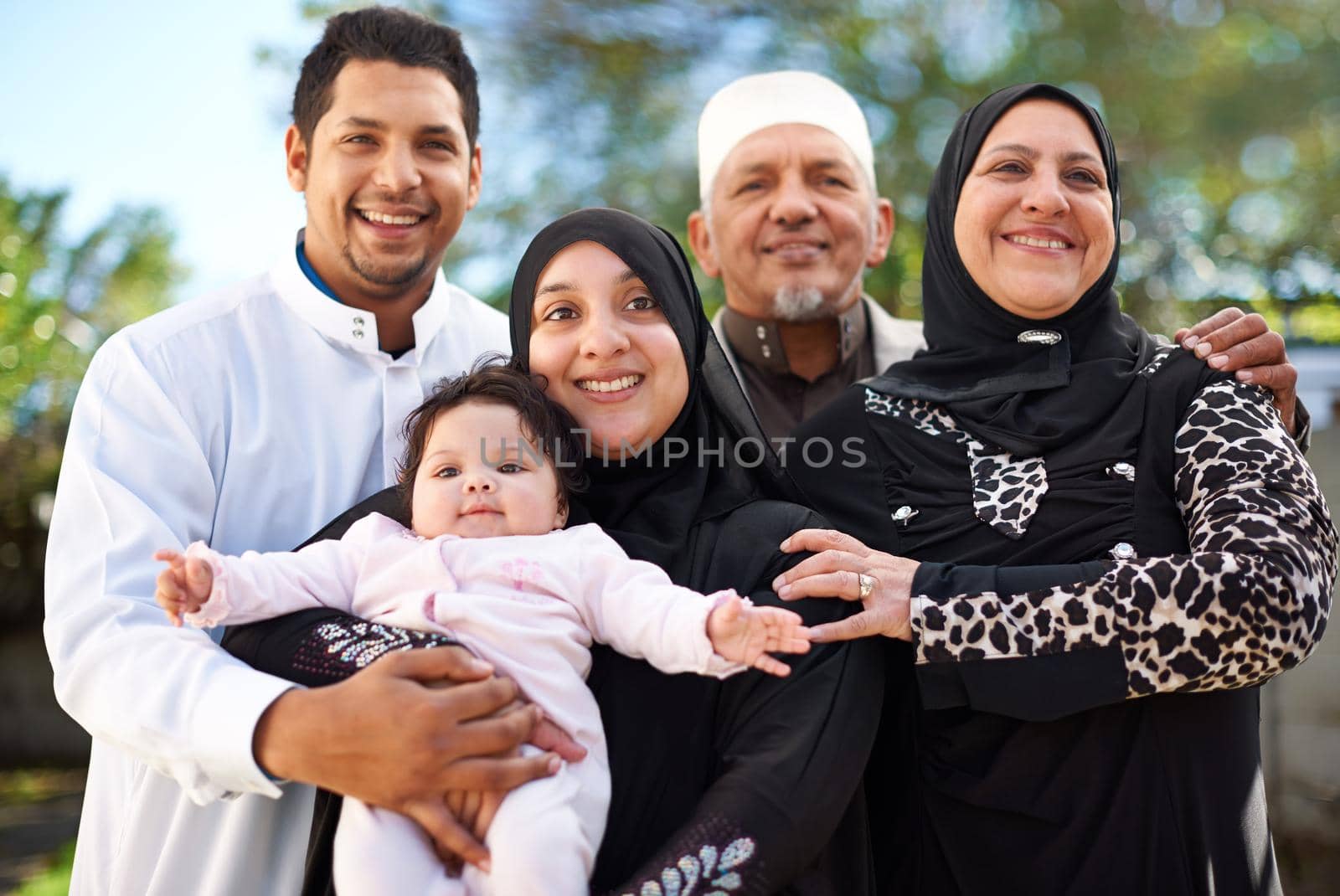 One big happy family. A muslim family enjoying a day outside. by YuriArcurs