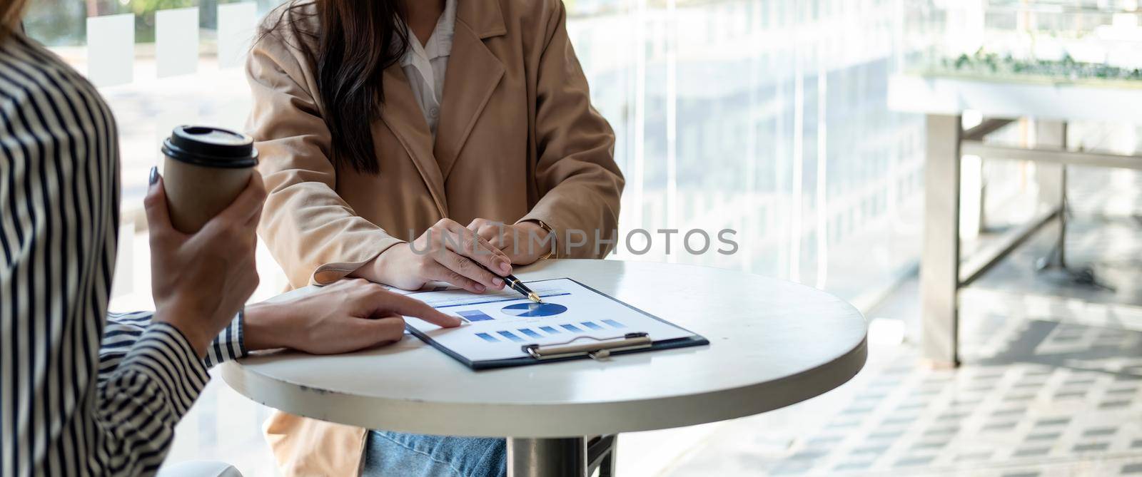 Close up business people meeting in office. hands hold documents with financial statistic discussion analysis report data the charts graphs Finance Teamwork successful Workplace strategy Concept by nateemee