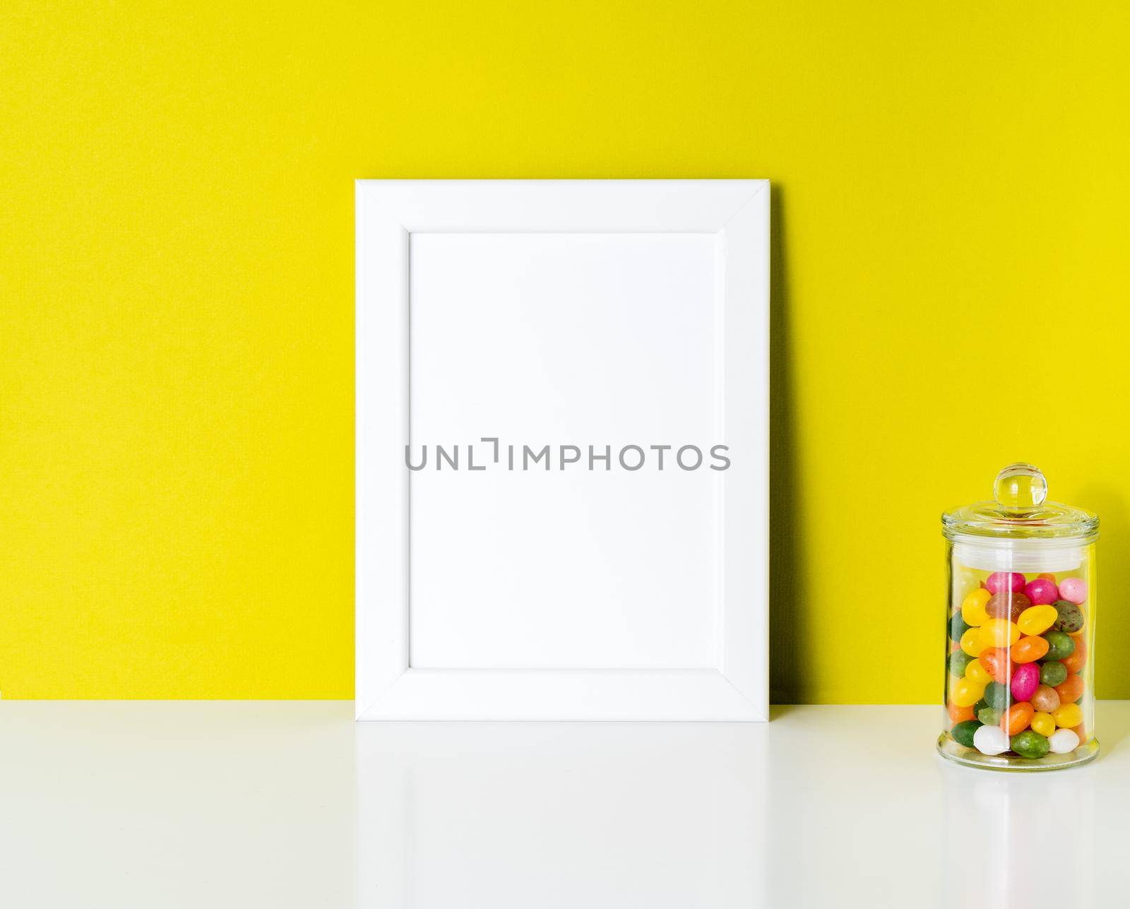 mock up frame on bright yellow paper wall by NataBene