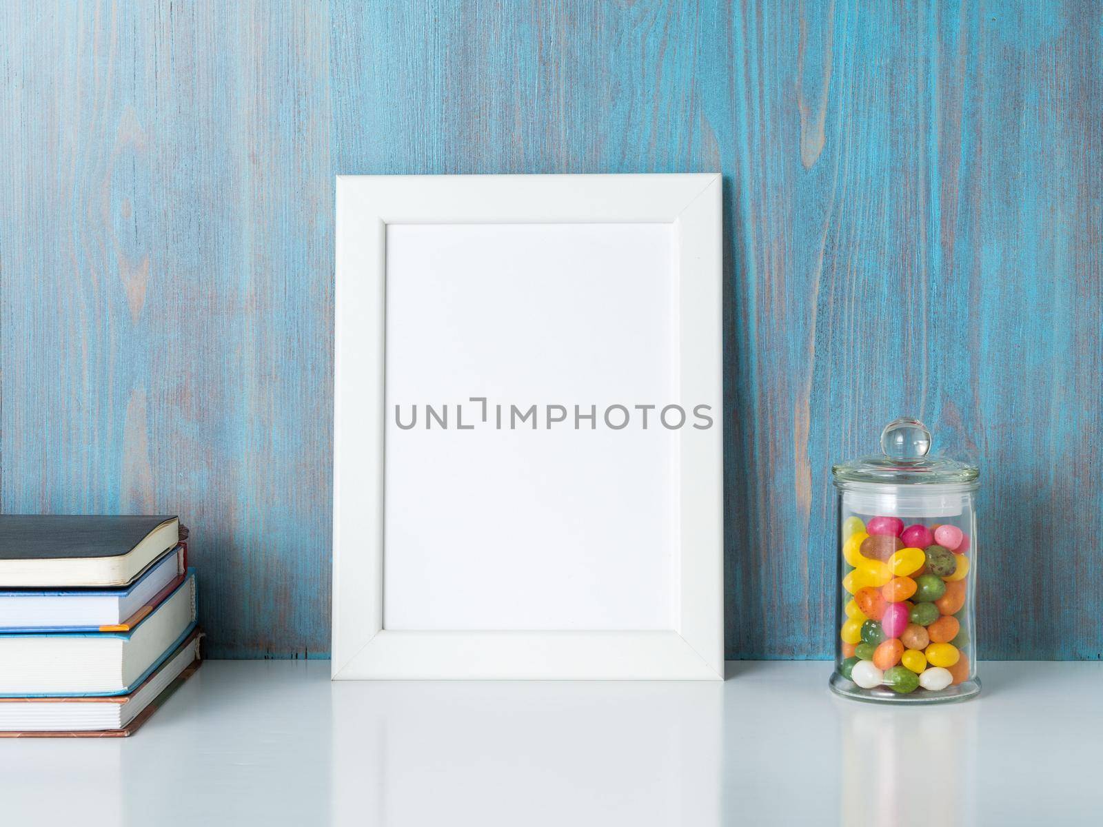 mock up frame on blue wooden wall by NataBene