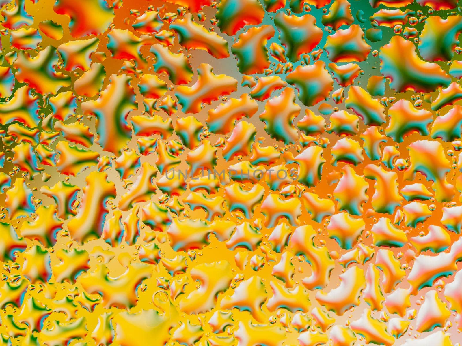 Abstract coloful vivid background with large and small convex drops of water on glass, condensation on window. Macro, close up.