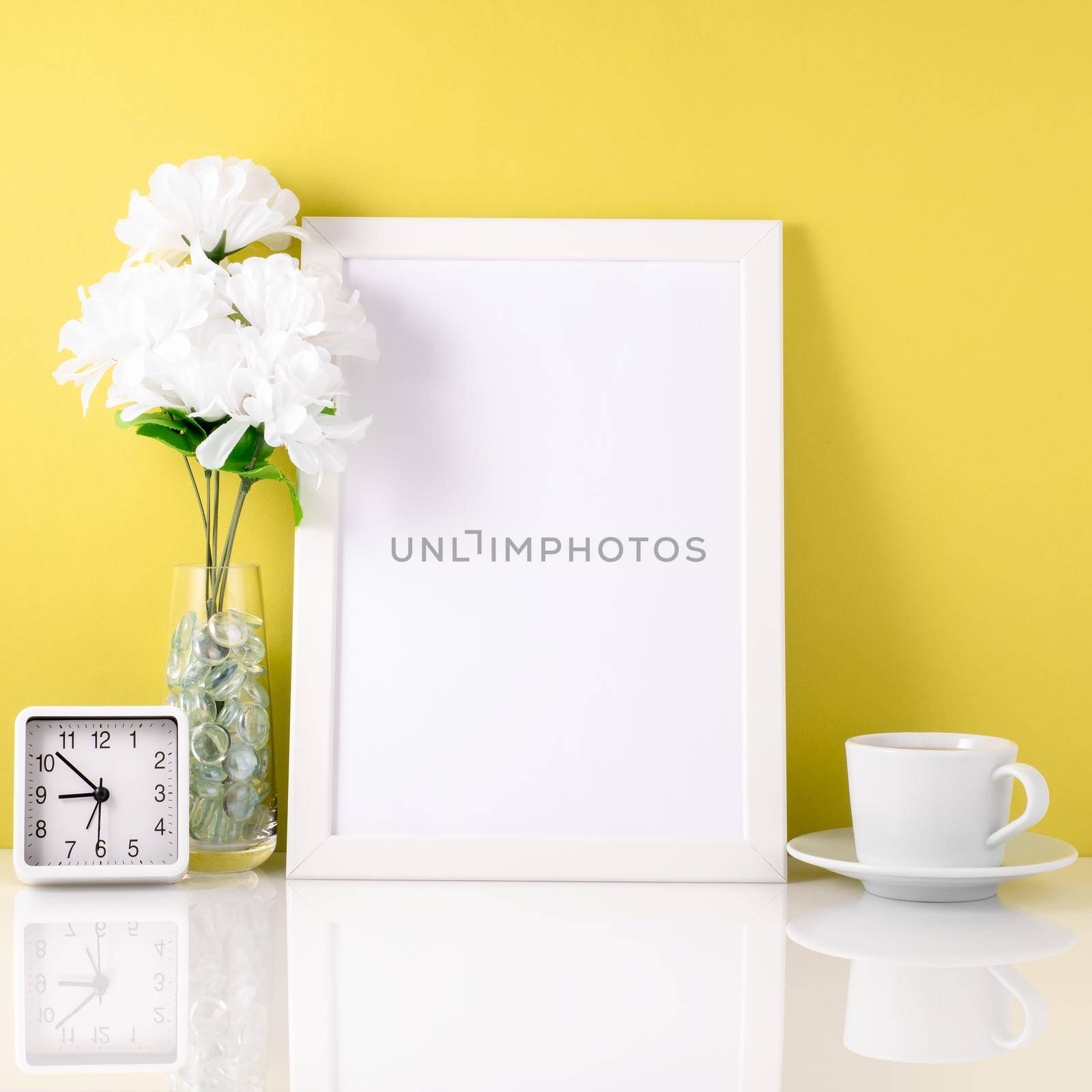 White frame, flower in vase, cup with tea or coffee, clock on wh by NataBene