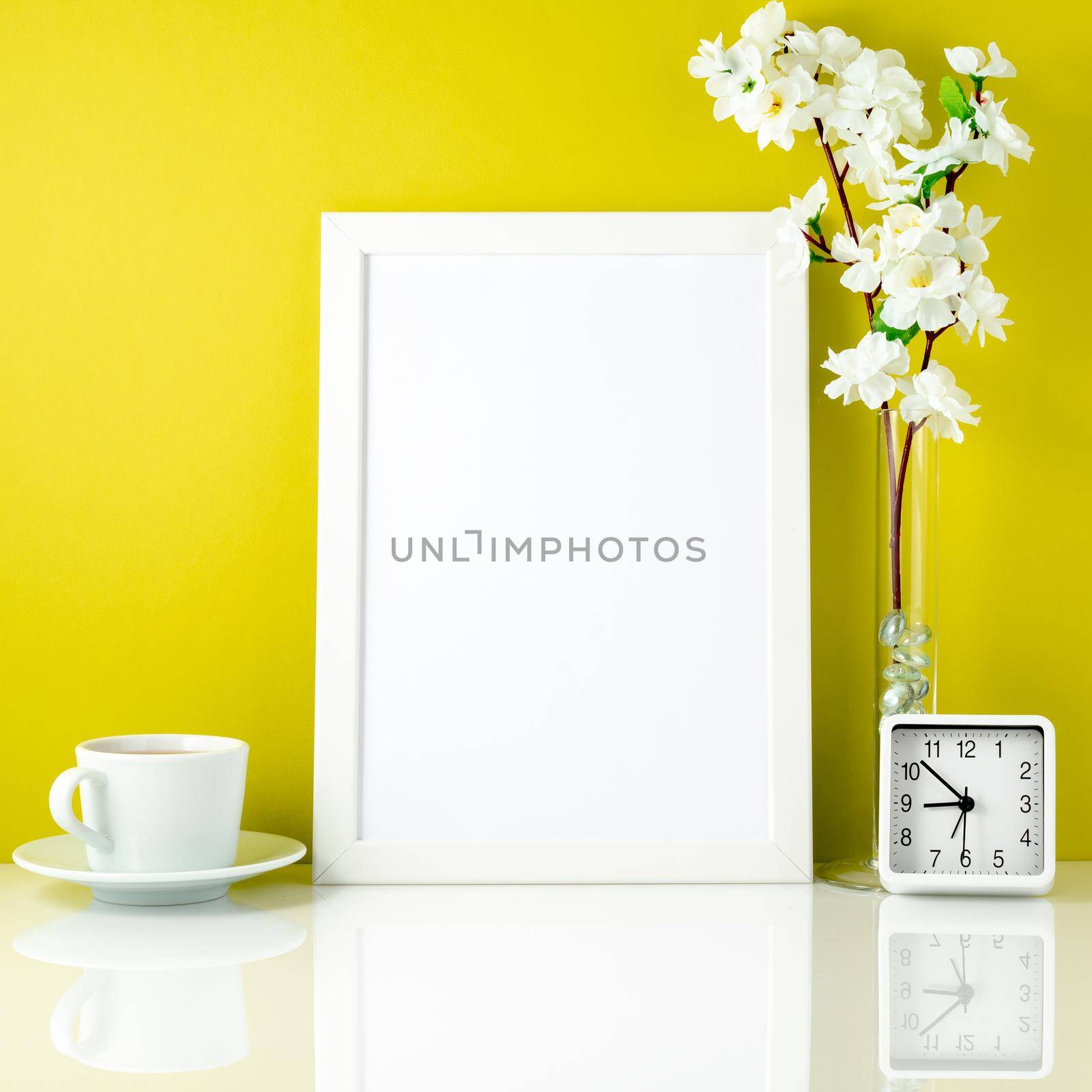 White frame, flower in vase, cup with tea or coffee, clock on wh by NataBene