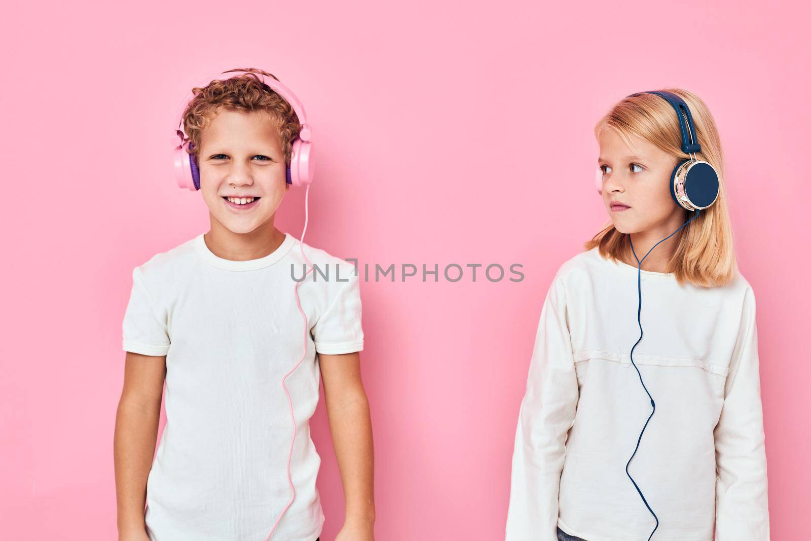 Stylish little boy and cute girl are playing together lifestyle childhood by SHOTPRIME