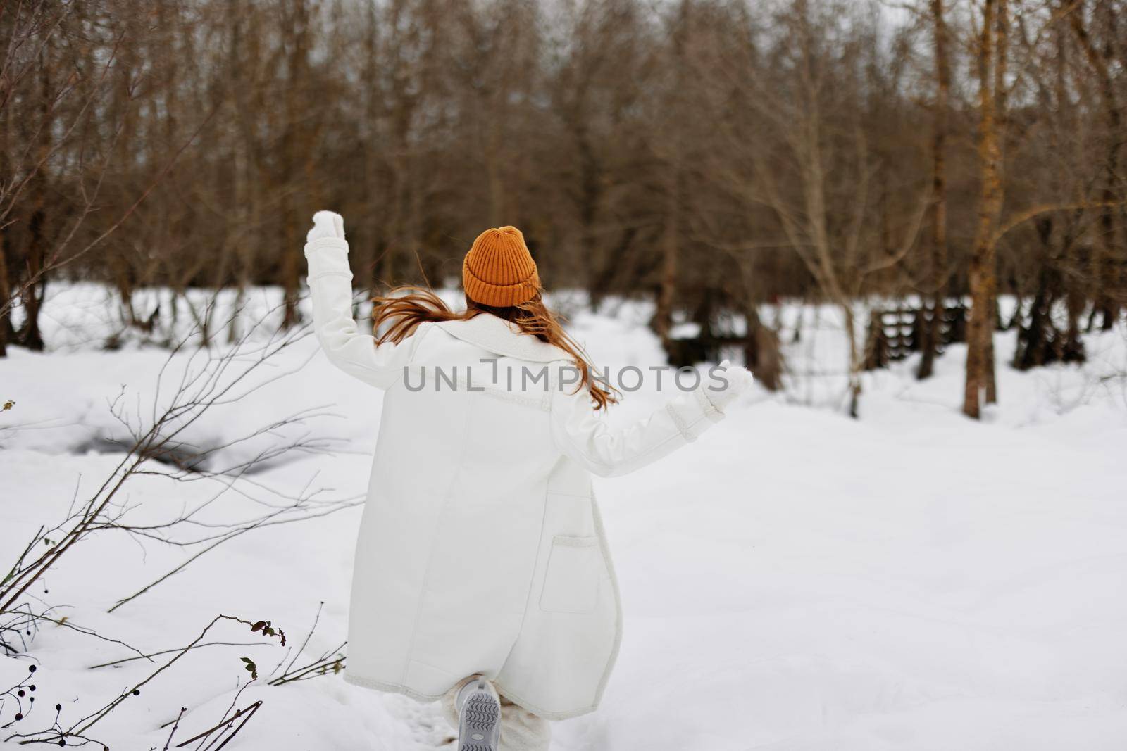 woman Walk in winter field landscape outdoor entertainment winter holidays by SHOTPRIME