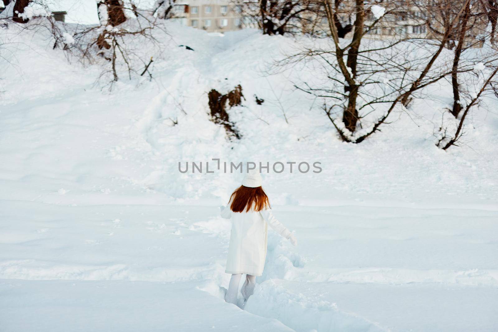 beautiful woman smile Winter mood walk white coat Lifestyle. High quality photo