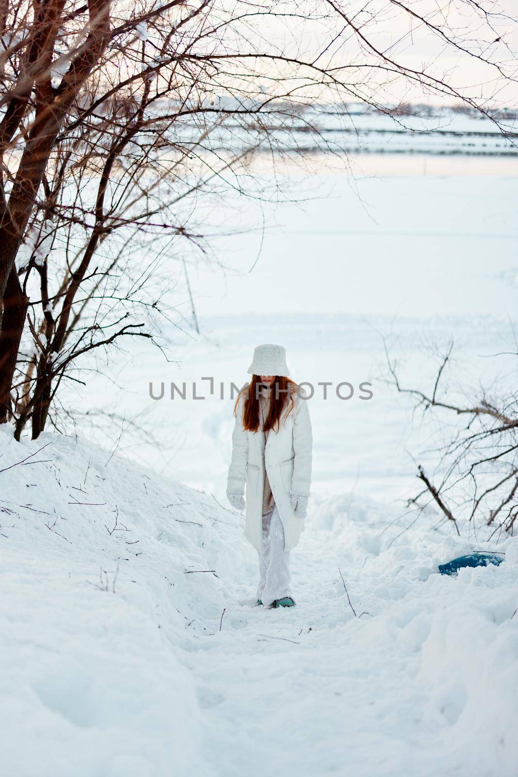 young woman winter clothes walk snow cold vacation nature. High quality photo