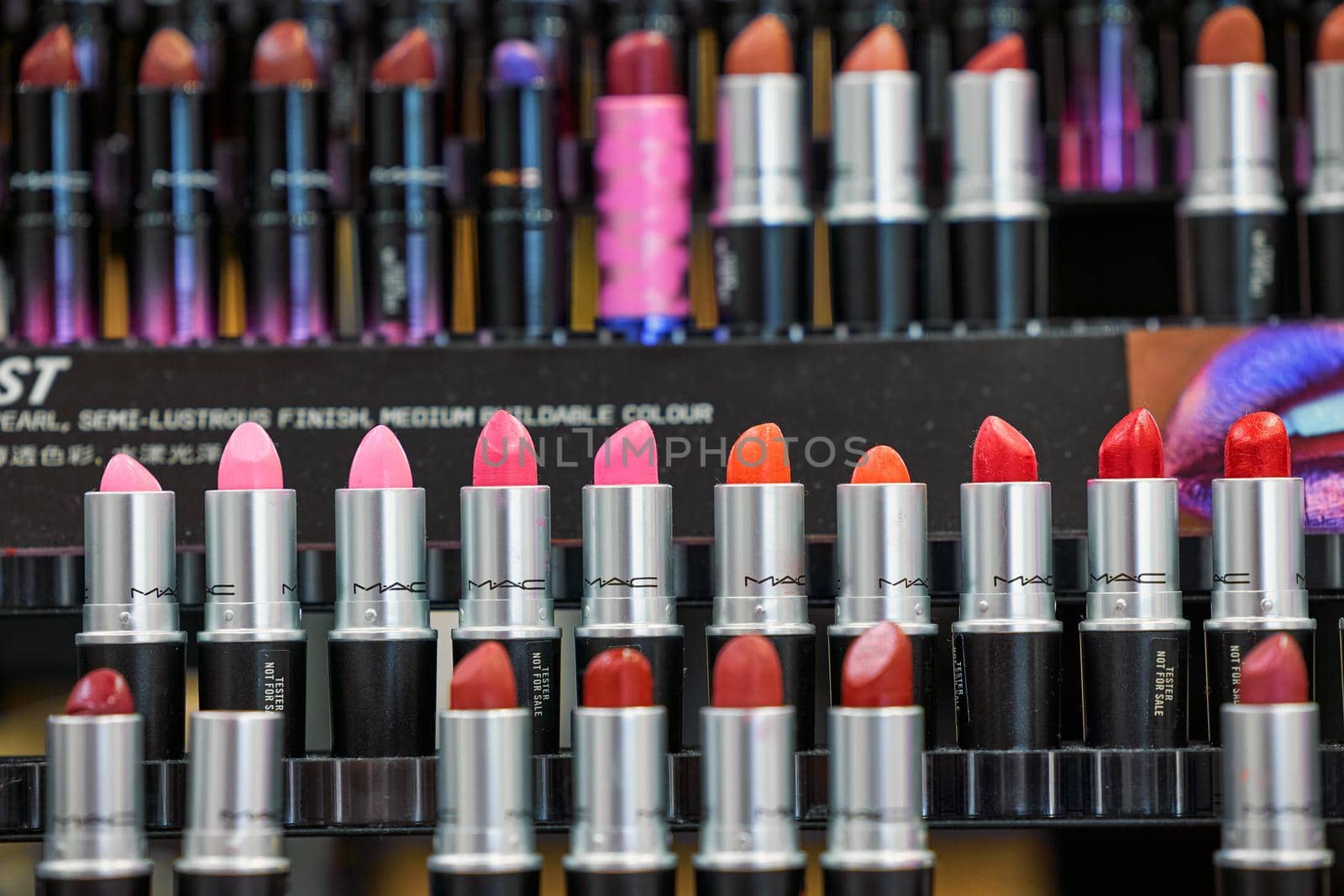 MAC Cosmetics lipstick on the stand. MAC lipstick testers displayed in a luxurious store. Excellent lipstick with a creamy formula, saturated pigments. 12,02,2022, Dubai, UAE.