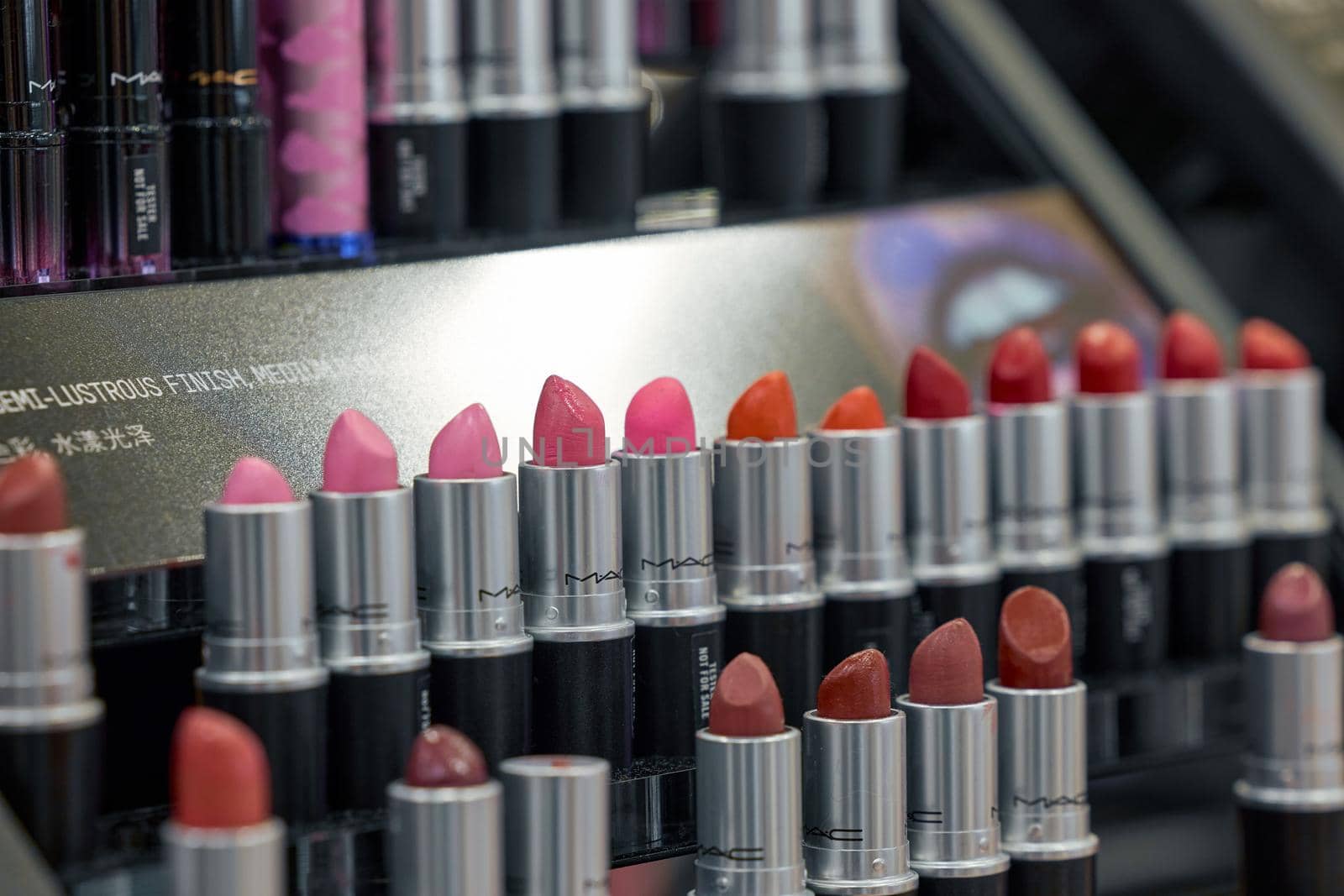 MAC Cosmetics lipstick on the stand. MAC lipstick testers displayed in a luxurious store. Excellent lipstick with a creamy formula, saturated pigments. 12,02,2022, Dubai, UAE.