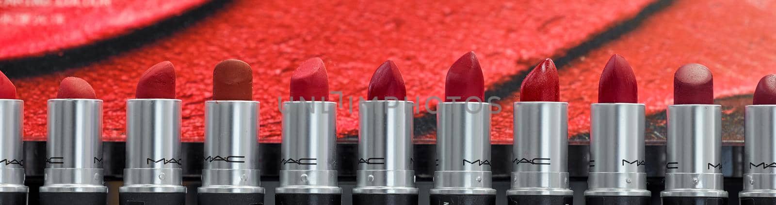 MAC Cosmetics lipstick on the stand. MAC lipstick testers displayed in a luxurious store. Excellent lipstick with a creamy formula, saturated pigments. 12,02,2022, Dubai, UAE.