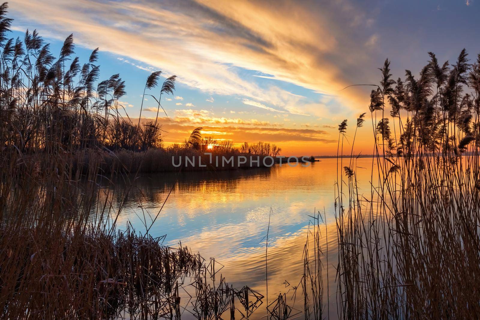 Beautiful sunset light over lake Balaton of Hungary by Digoarpi