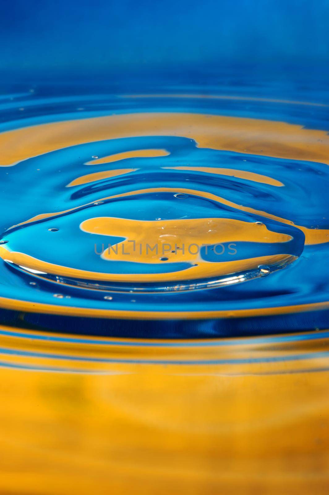 Close-up view on blue and yellow aquarelle paint like Ukrainian flag by Novic